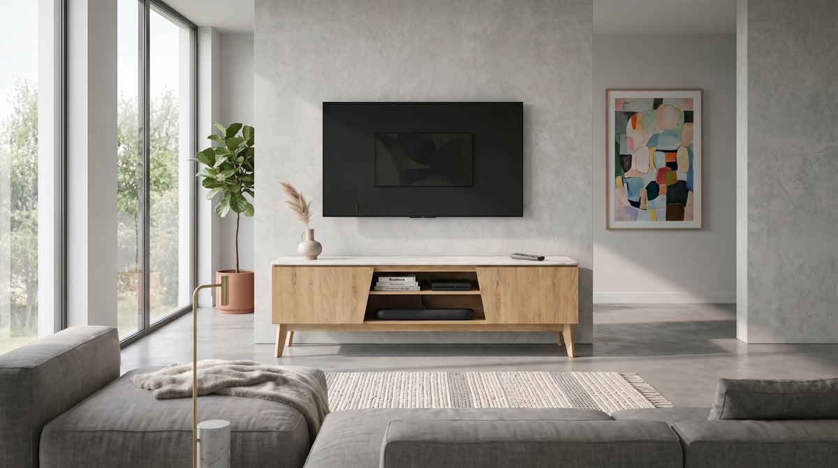 Macleod TV Unit with a marble-look top and oak-look doors under a wall-mounted TV, with a grey sofa in front