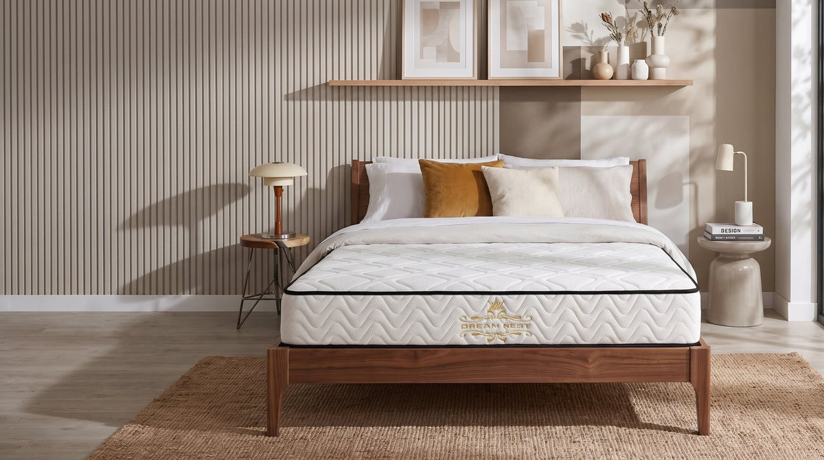 Sleep Essential III Pocket Spring Mattress on a timber bed frame in a calm neutral bedroom