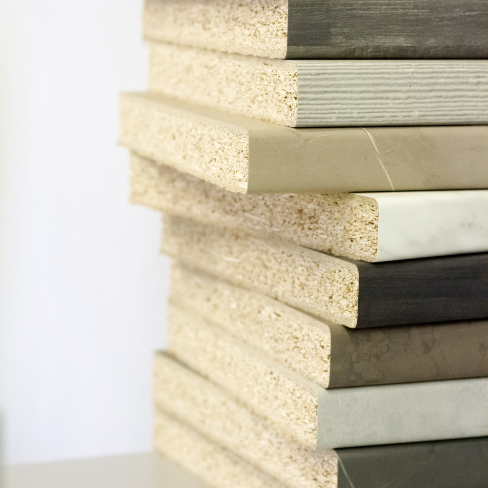 Stack of engineered wood panels with various finishes for furniture making