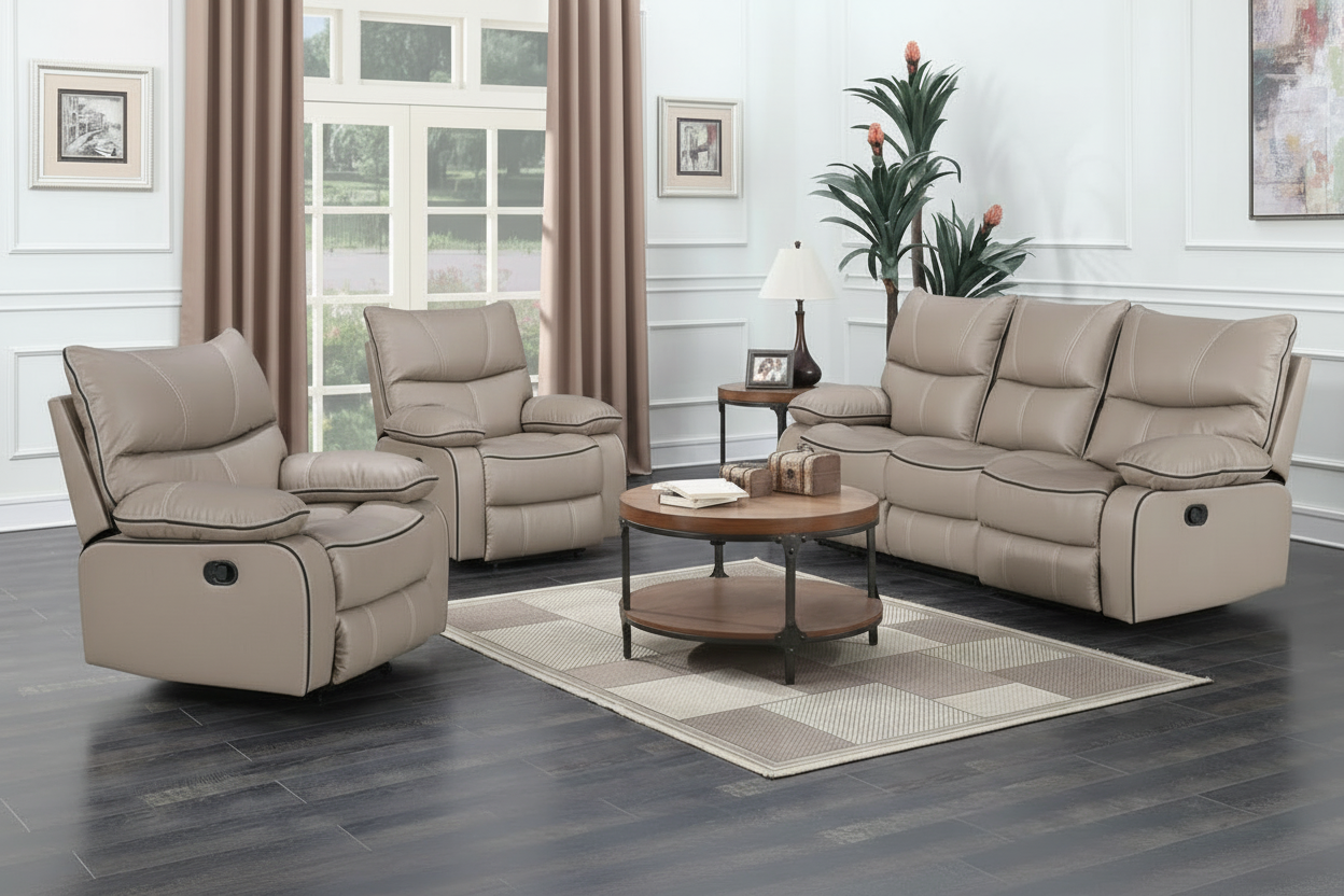 Beige reclining sofa set in a living room with a coffee table and decor.