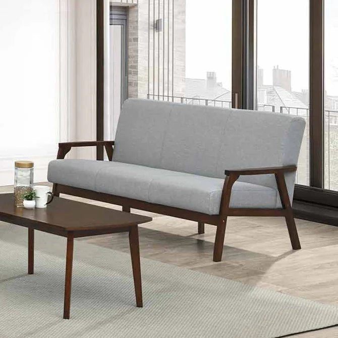 Gray sofa with wooden frame in a modern living room setting