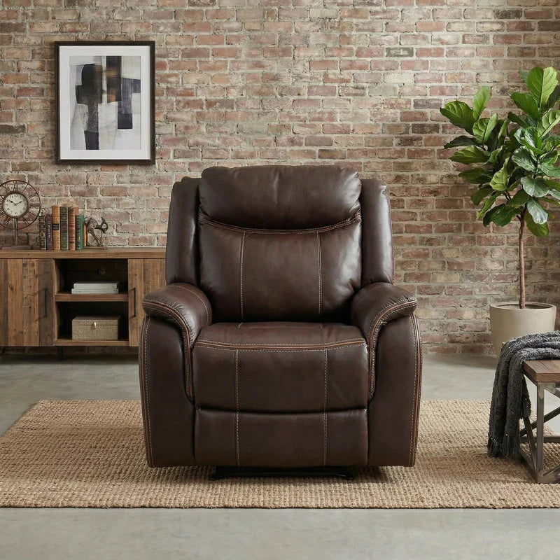 Sunshine Rocker & Swivel Recliner Chair in dark brown leather positioned in a cozy living room setting with brick wall, wooden console, and green plant for a stylish lounge space.