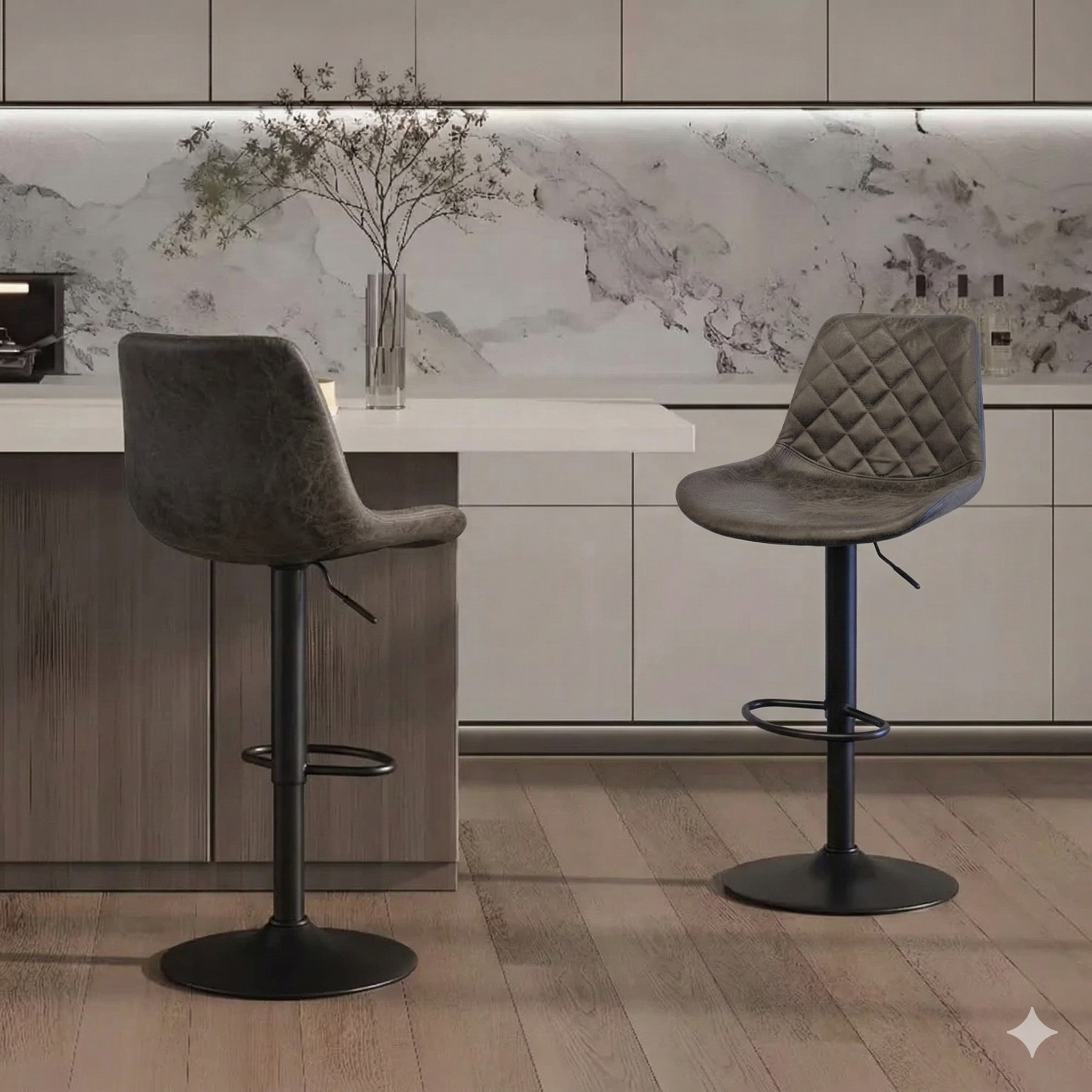 Modern grey bar stools with black metal bases at a kitchen island, marble backsplash, minimalist decor
