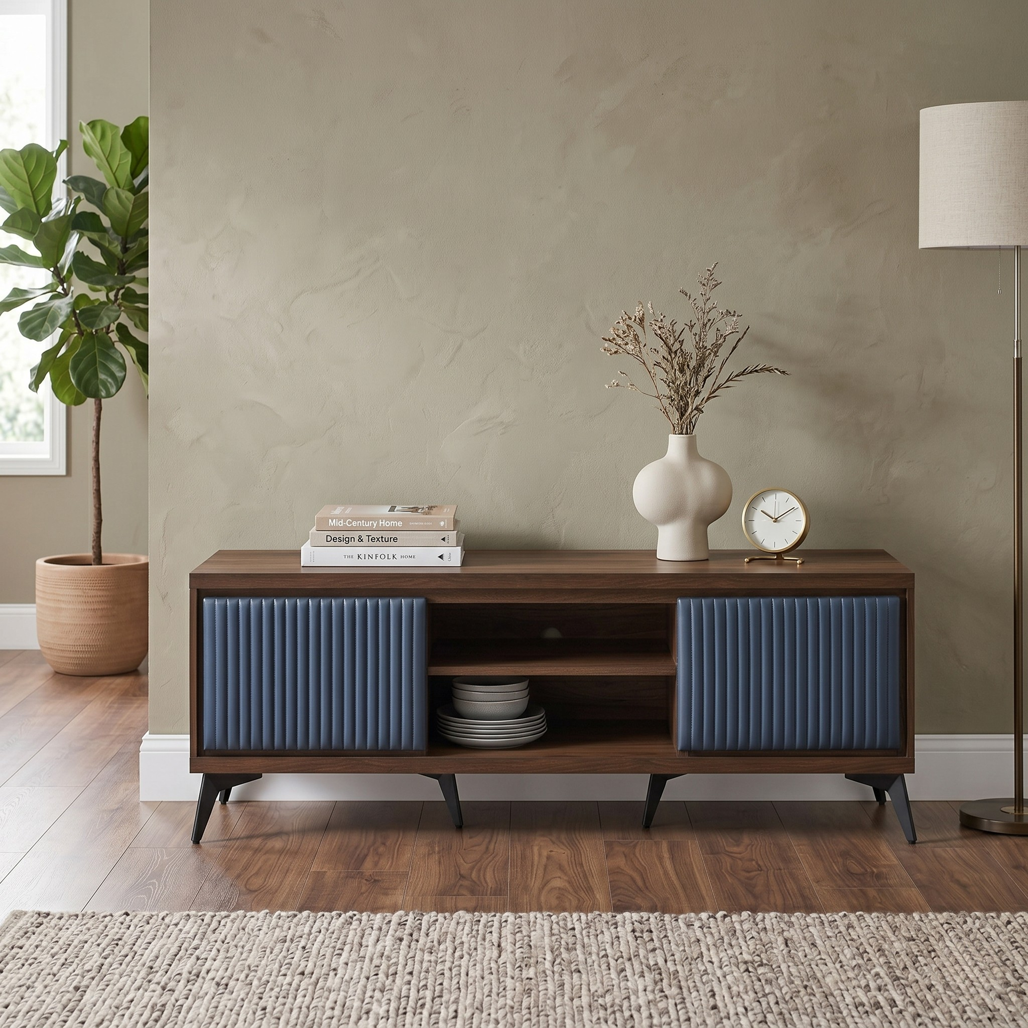 Wooden console table with blue speakers against a beige wall