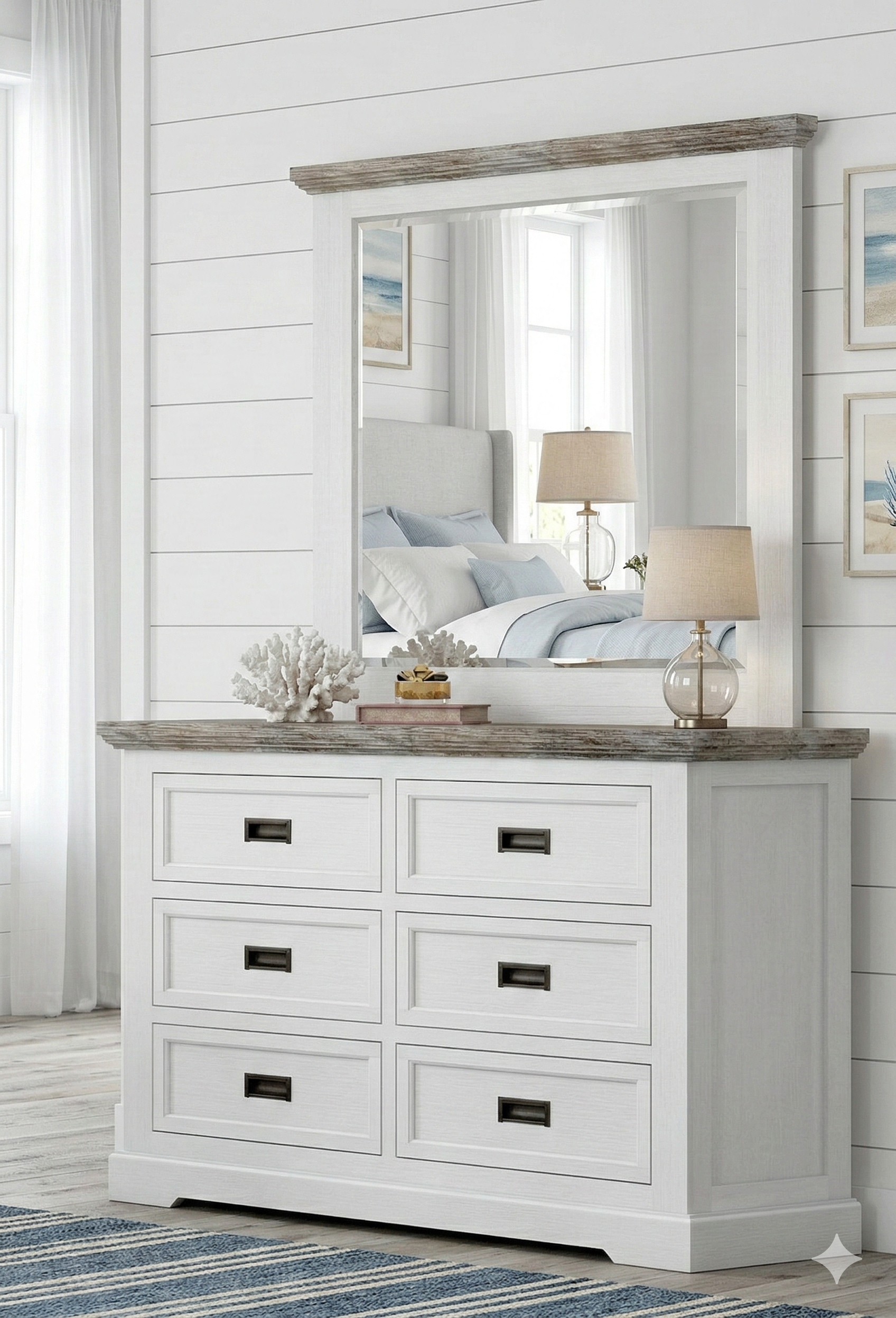 White dresser with mirror and decorative items in a bedroom setting