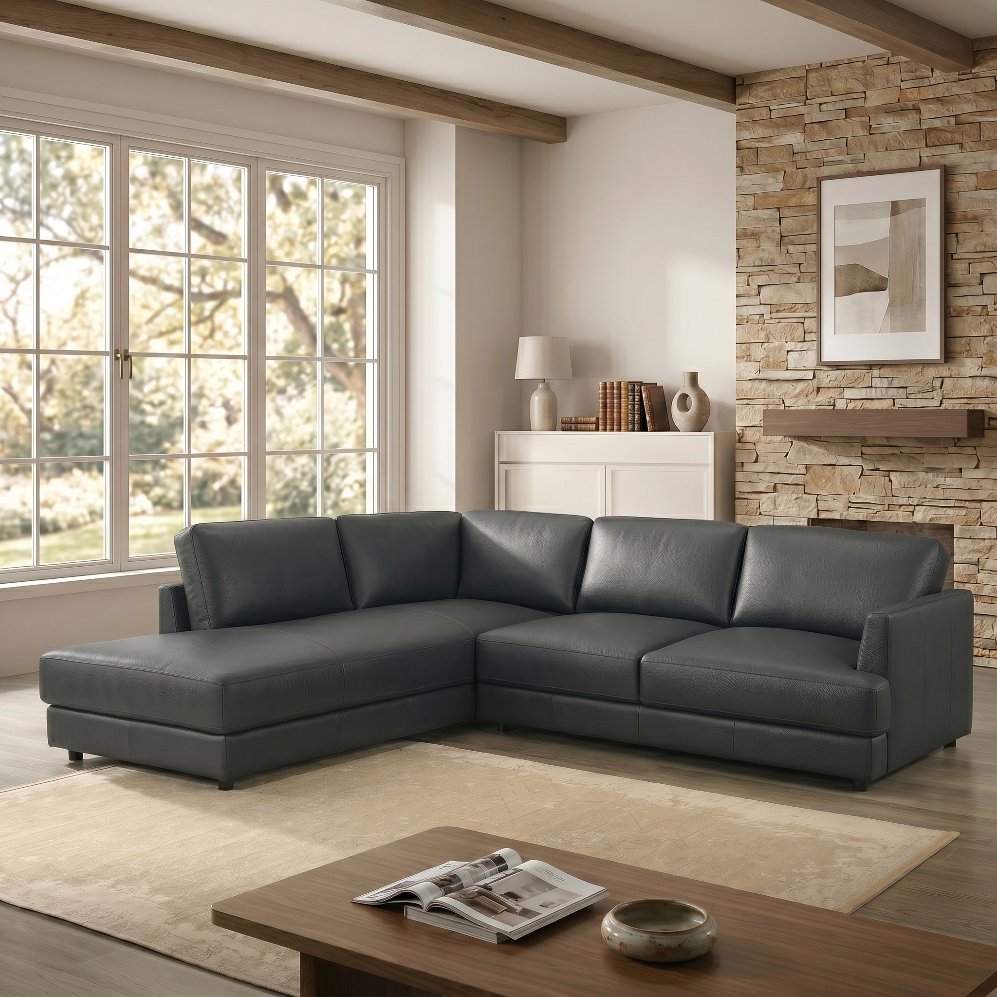 Modern living room with an anthracite sectional sofa, wooden coffee table, and stone wall.
