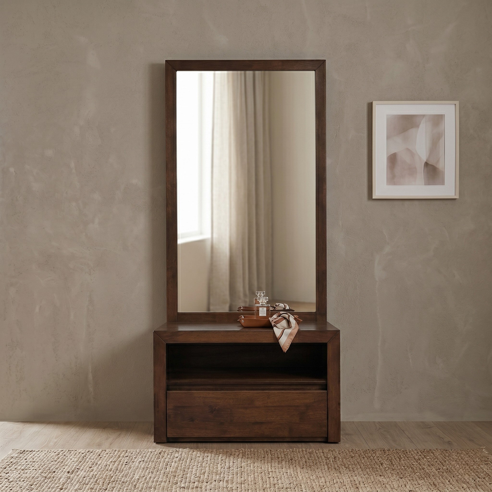 Wooden dresser with mirror against a beige wall