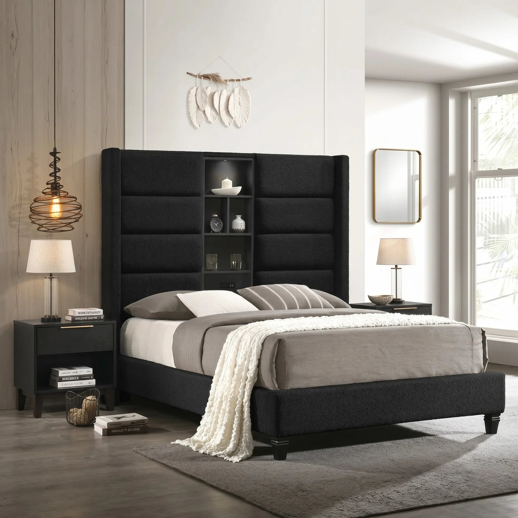 Modern bedroom with a black upholstered bed and bookshelves.