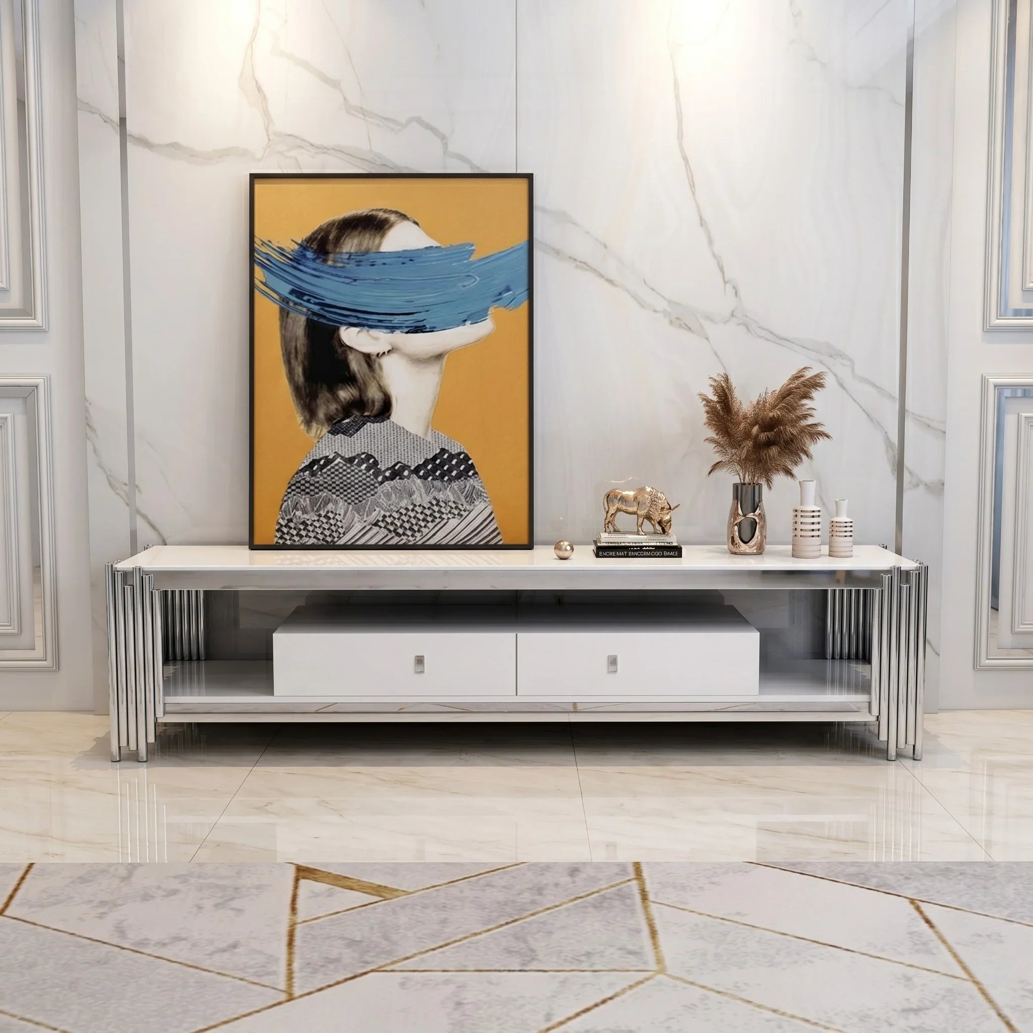 Modern living room with a white entertainment console, decorative items, and a framed artwork on a marble wall.