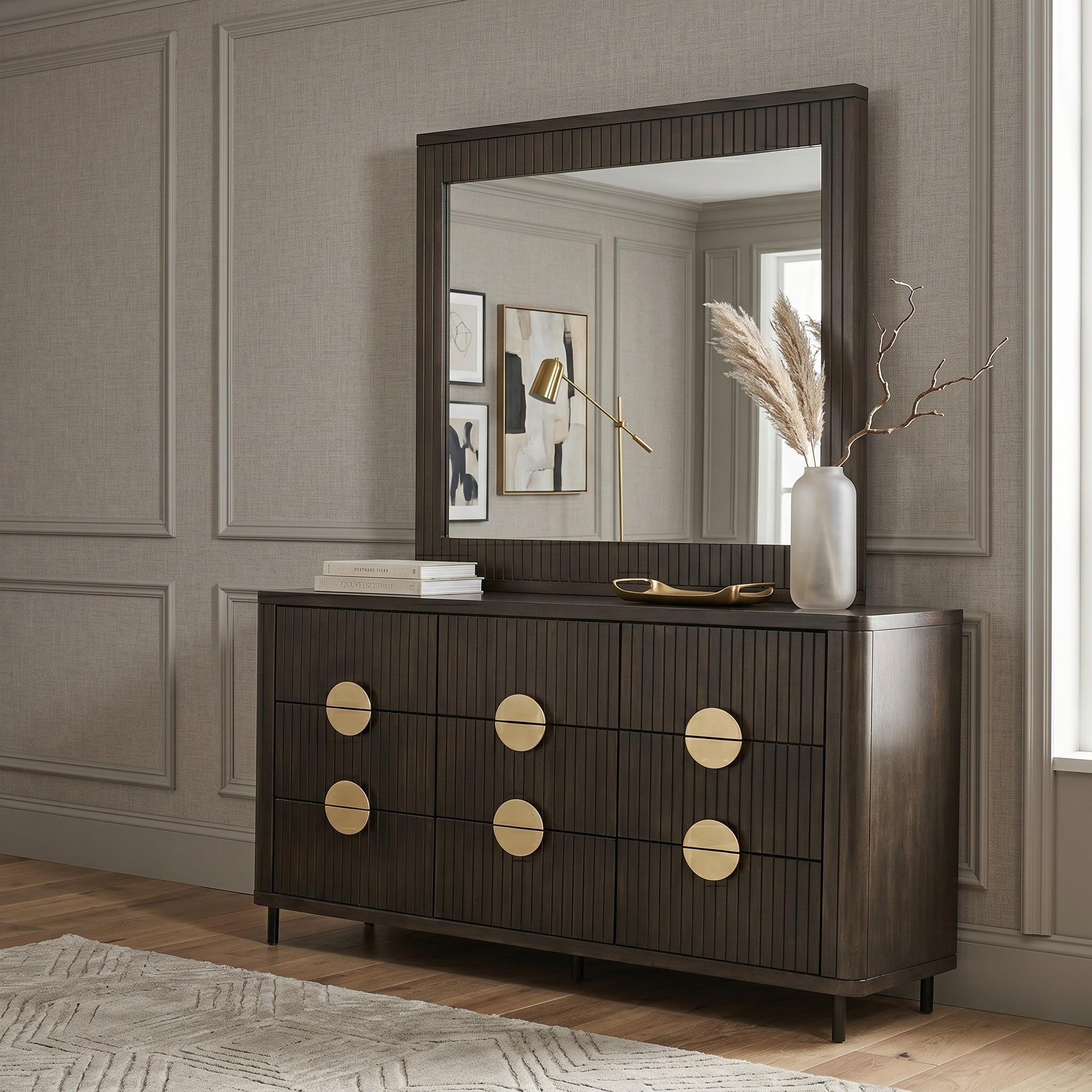 Dark wood dresser with gold accents in a room with a mirror and decor.