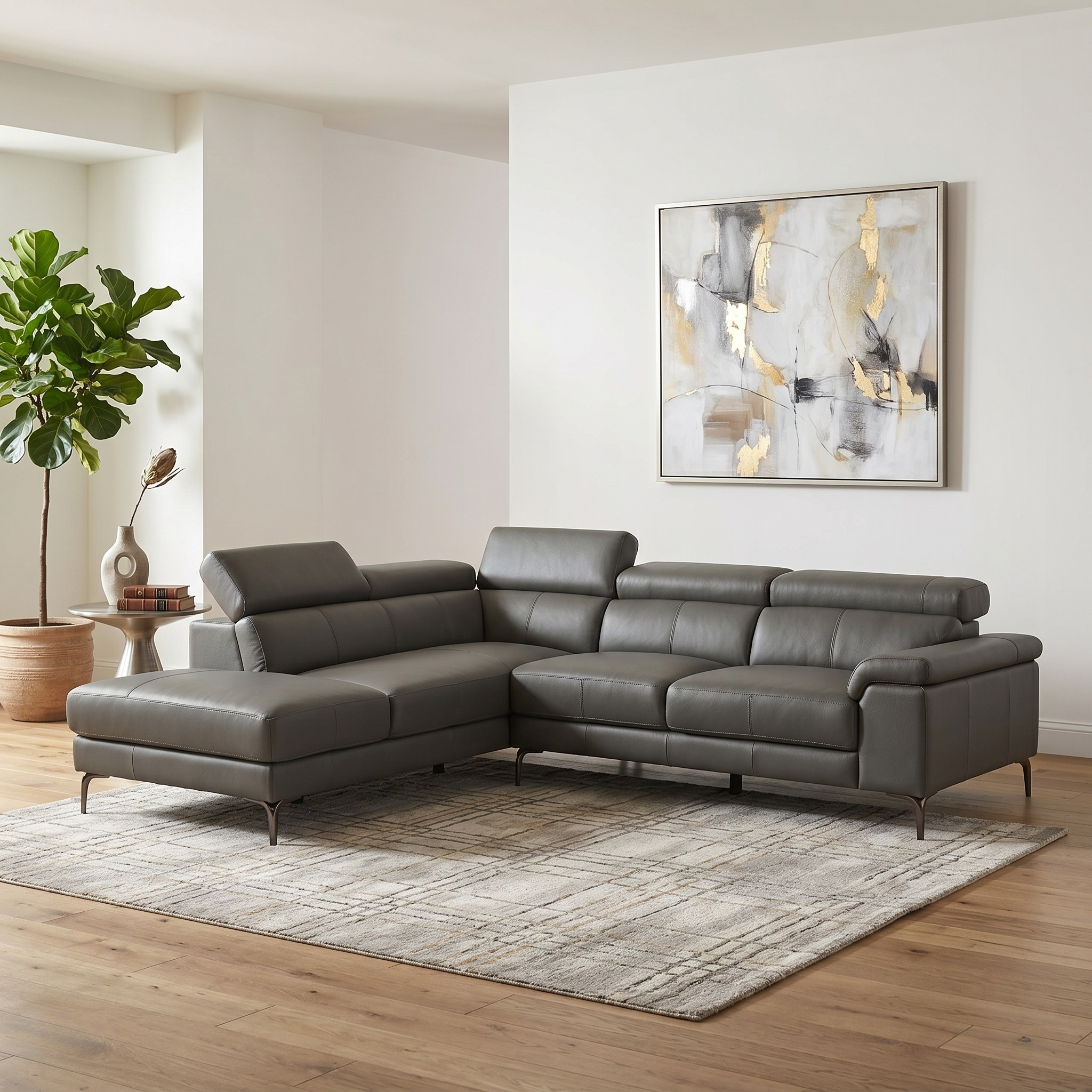 Anthracite sectional sofa in a living room with abstract art and plant decor.