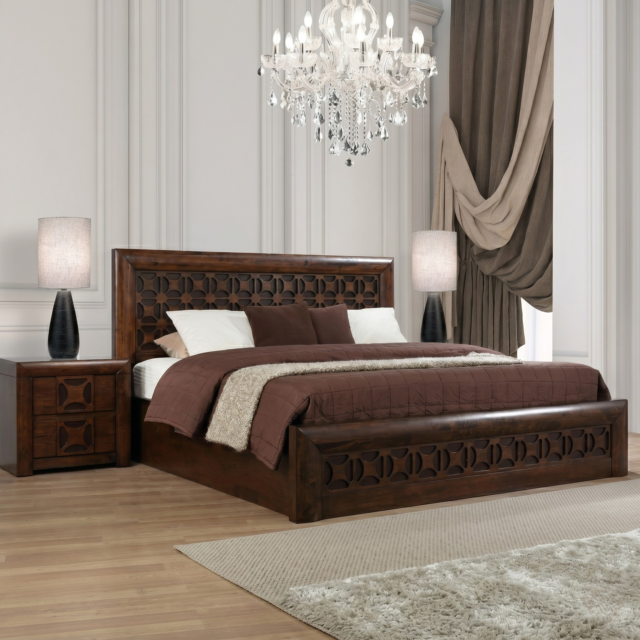 Wooden bed with brown bedding in a bedroom setting with a chandelier and lamps.