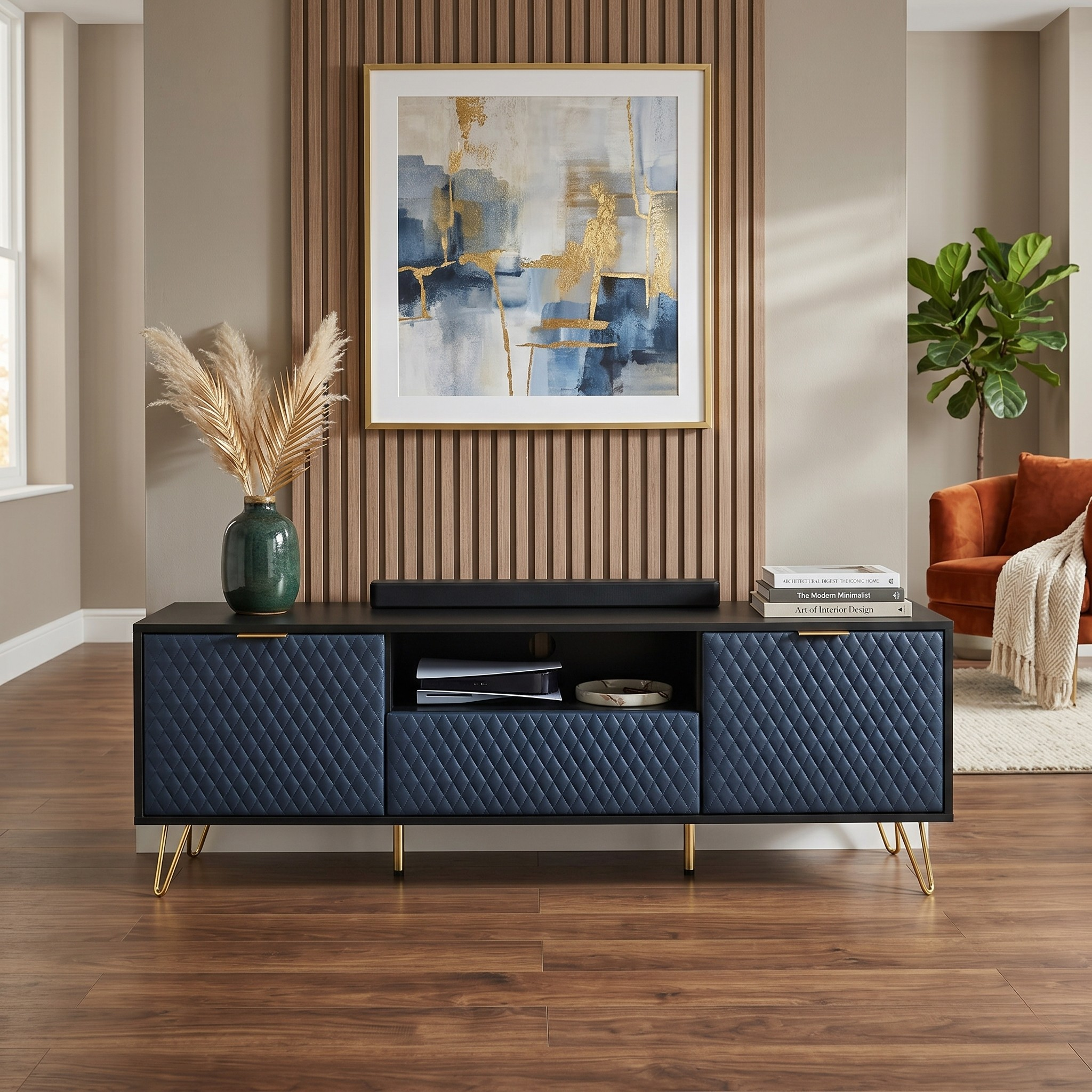 Modern living room with a blue quilted TV stand, abstract art, and a plant.