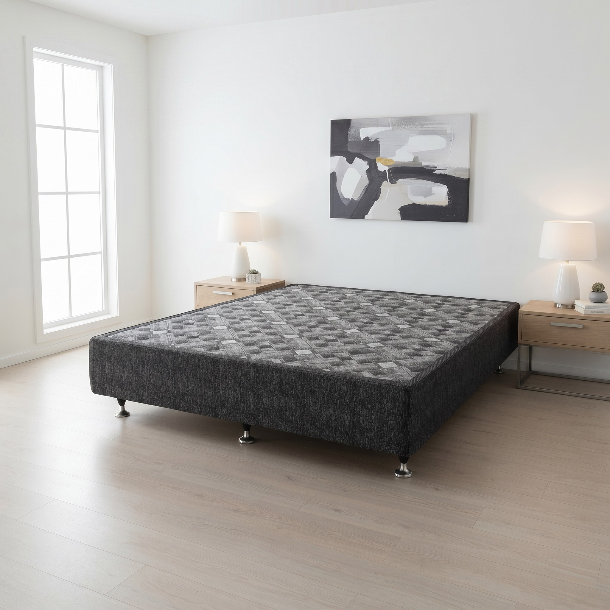 bed base in a minimalistic bedroom with abstract art on the wall.