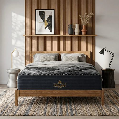 Bedroom with a wooden bed frame and mattress, shelves with decor, and a rug.