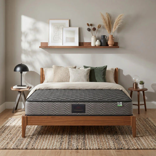 Sleep Essence Bonnell Spring Mattress on a wooden bed frame in a modern bedroom with neutral décor, decorative pillows, side tables, and wall art.