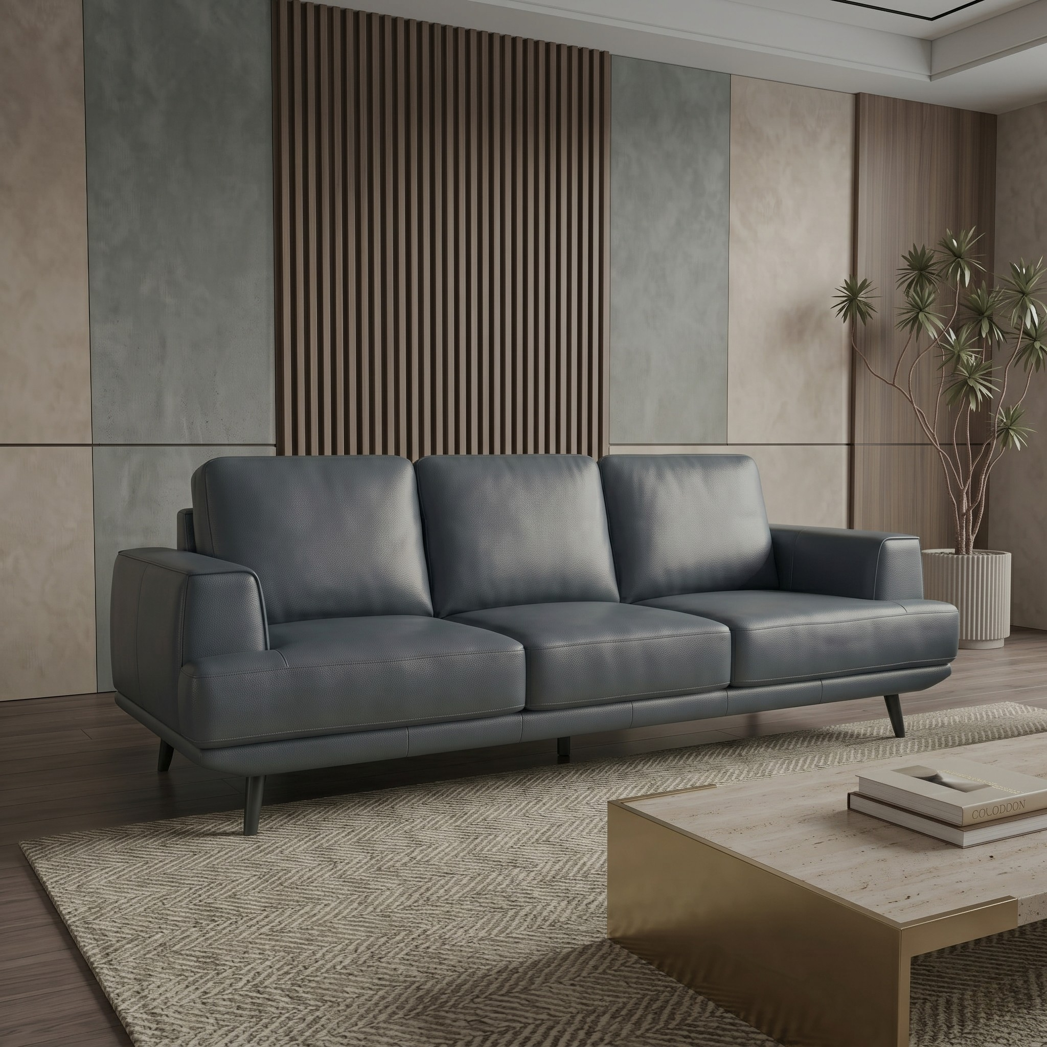 Anthracite sofa in a modern living room with a wooden coffee table and decorative plants.