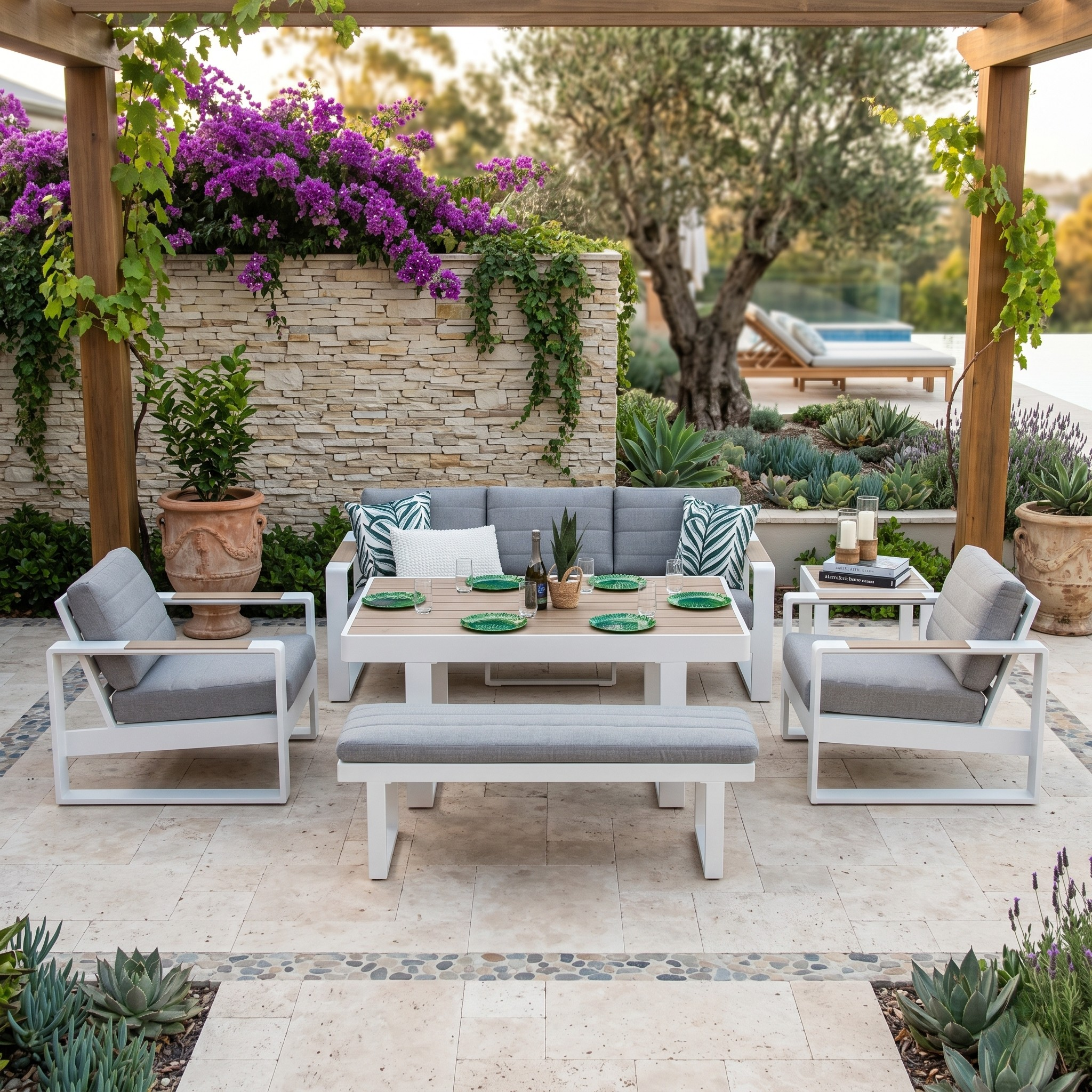 Outdoor patio set with furniture and table setting in a garden.
