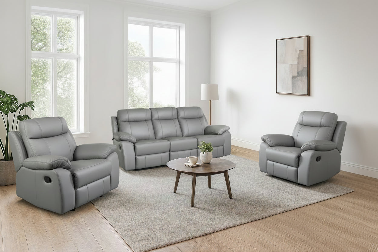 Gray sofa set in a living room with a coffee table and decor.