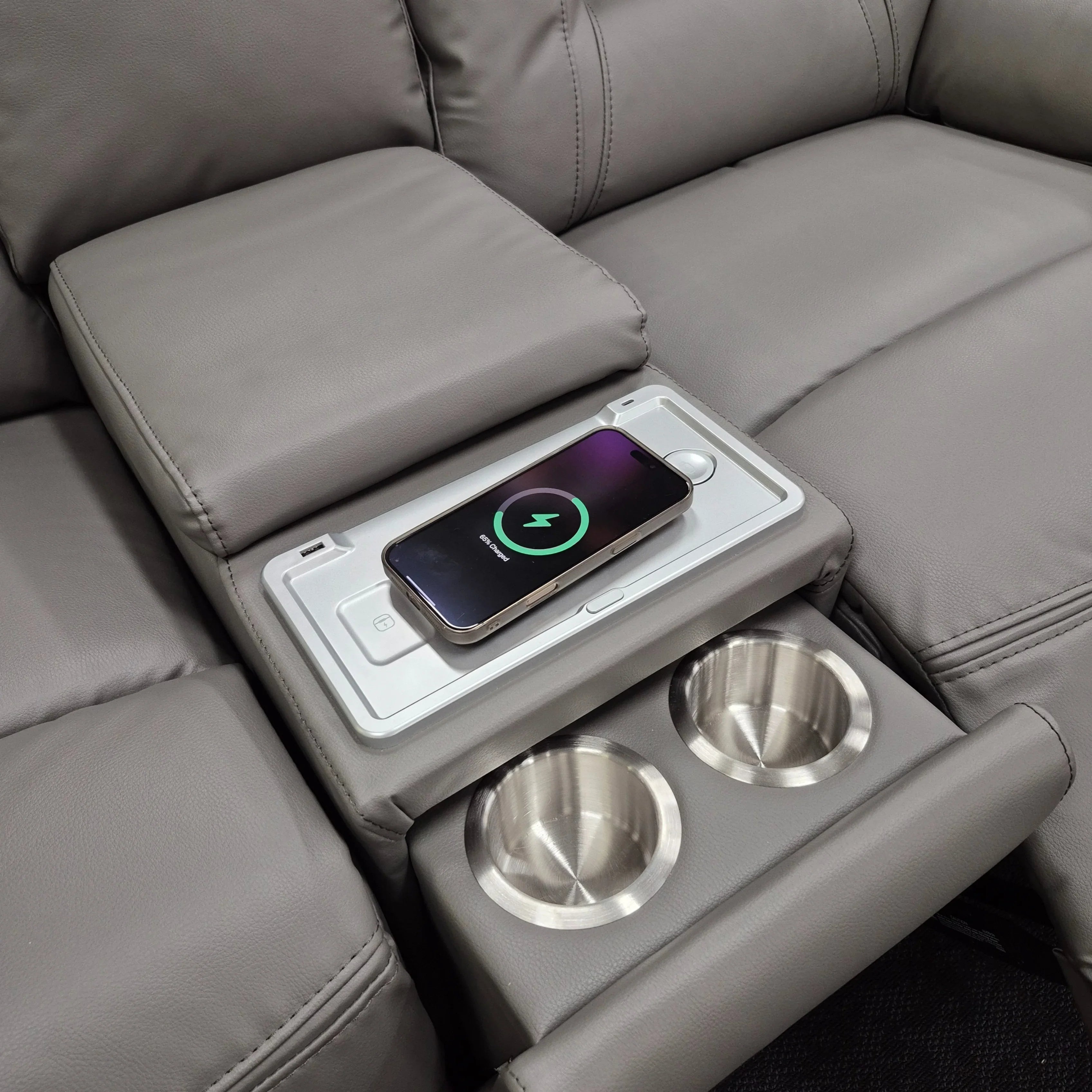 Grey leather electric recliner corner sofa with wireless phone charger and dual cup holders