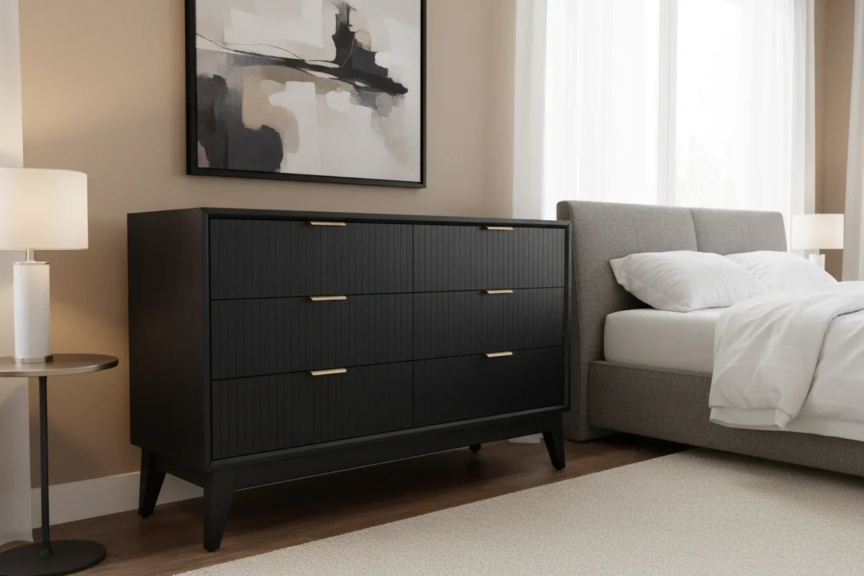 Modern 6-drawer dresser without a mirror in a black wooden design in a bright bedroom.