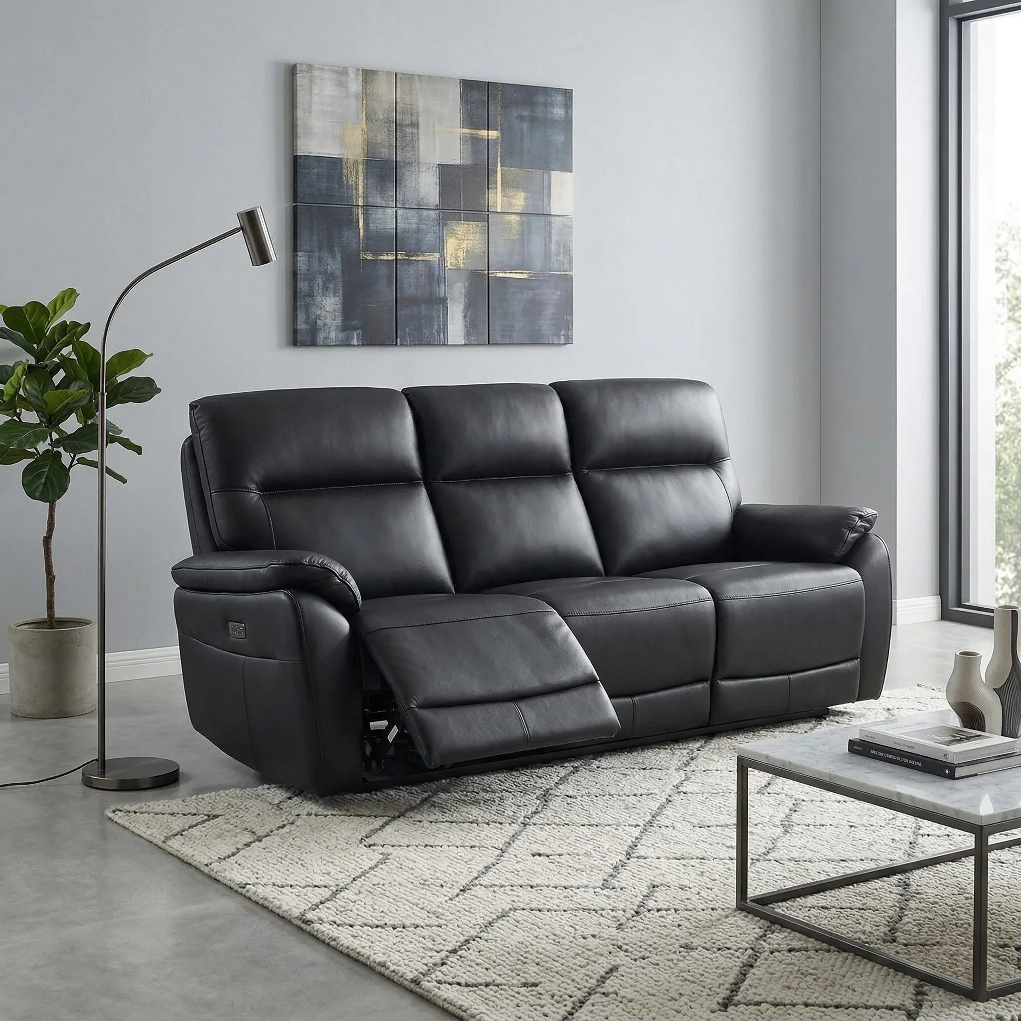 Armdale 3 Seater Leather Electric Recliner Lounge in black leather with plush cushioning and adjustable reclining seats, placed in a modern living room setting.