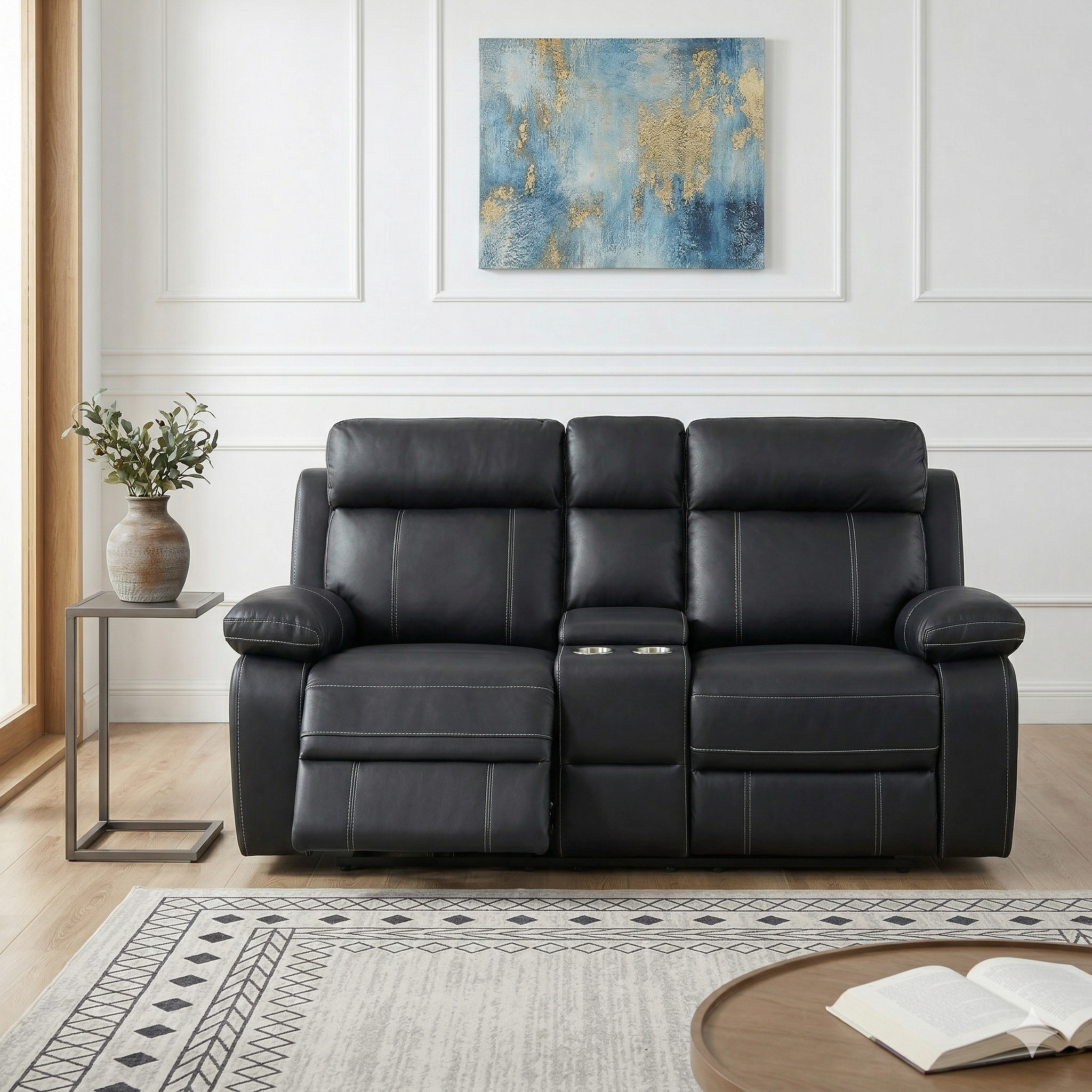 Black fabric sofa in a living room with abstract art on the wall.