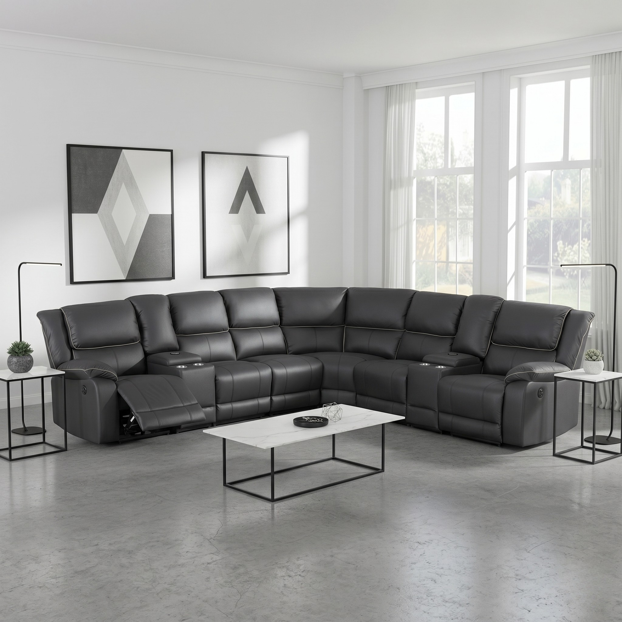 Black sectional sofa in a modern living room with a coffee table and decorative items.