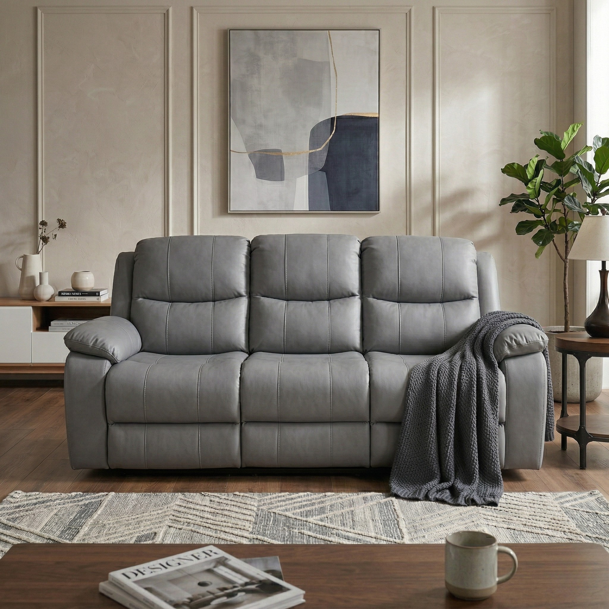 Charcoal sofa in a living room with a coffee table, rug, and wall art.