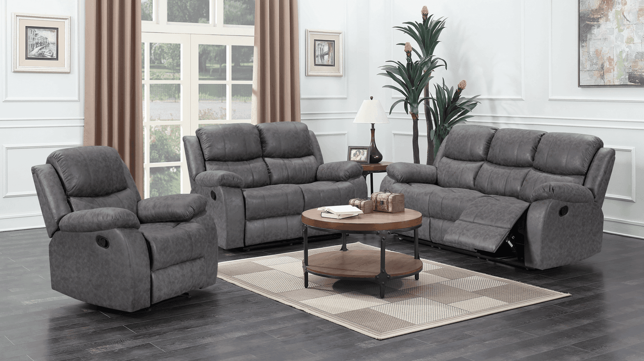 Modern living room with grey recliner sofa set, armchair, coffee table, and large windows