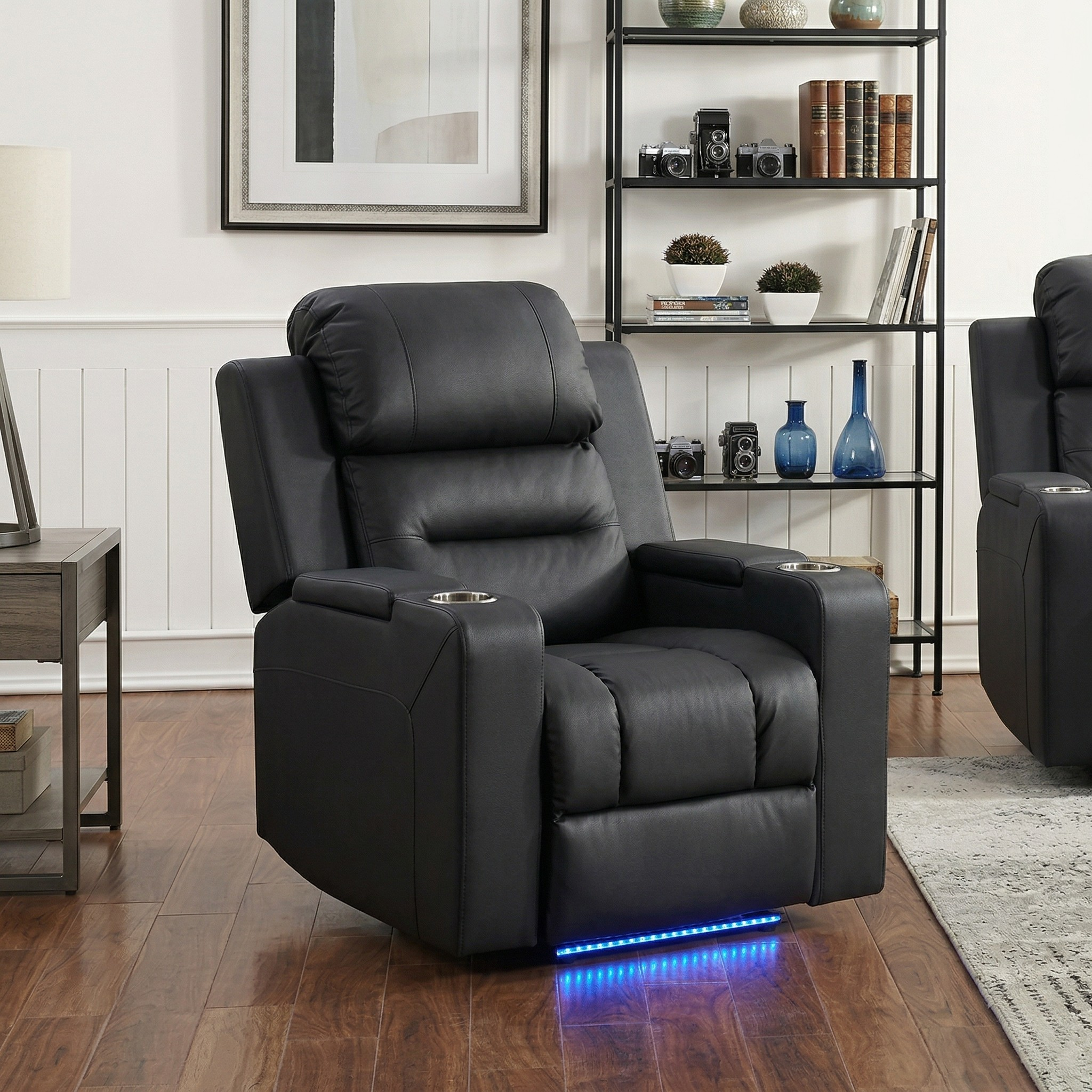 Black leather recliner chair with LED lighting in a living room setting.