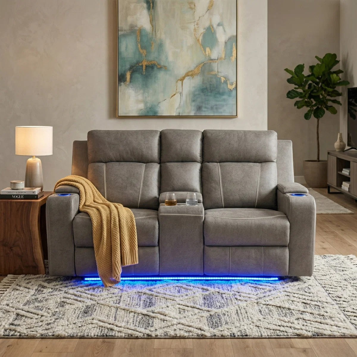 Broom 2 Seater Recliner Lounge in grey fabric with cup holders, built-in storage, and LED lighting underneath, styled in a modern living room with neutral decor.