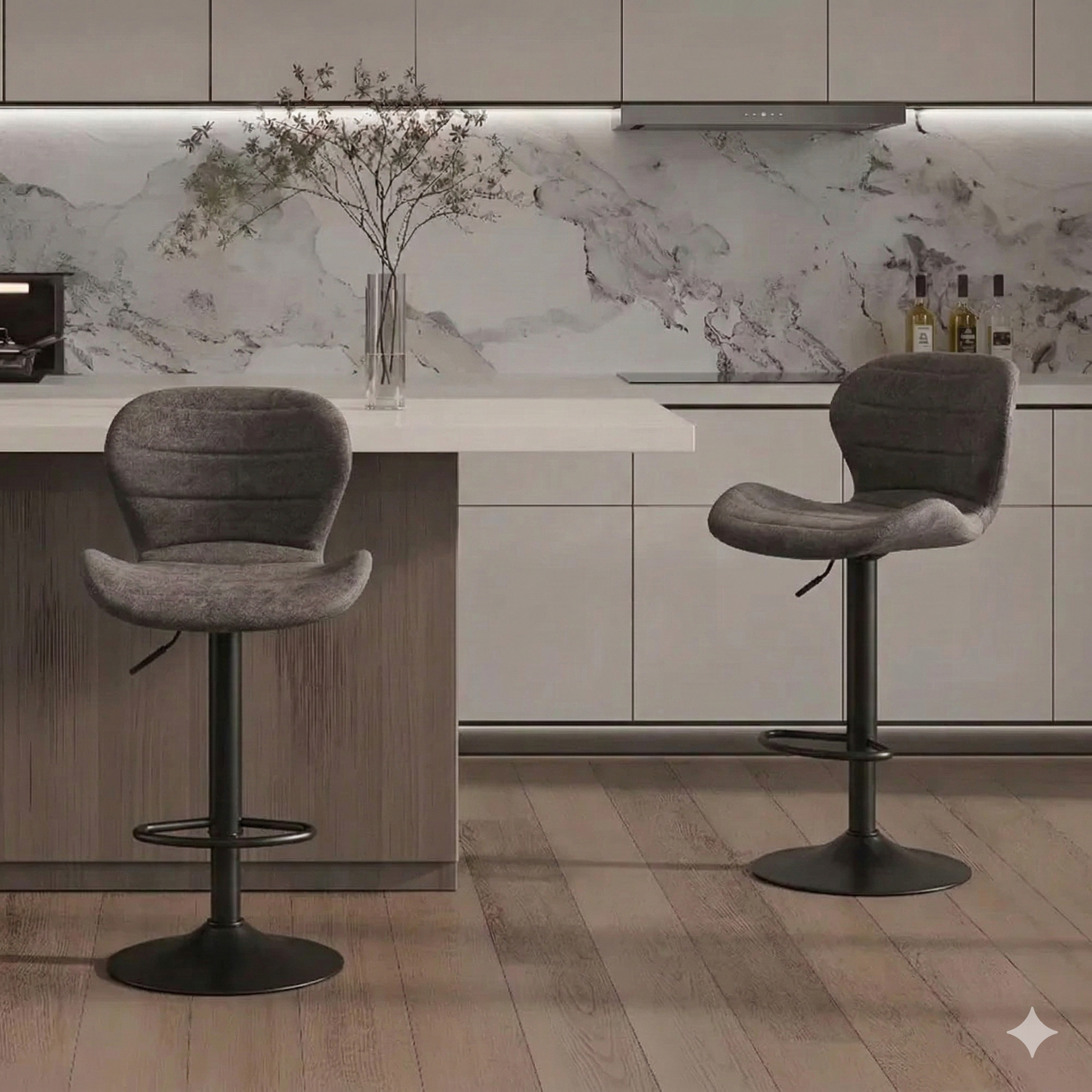 Two gray bar stools in a modern kitchen with marble backsplash.