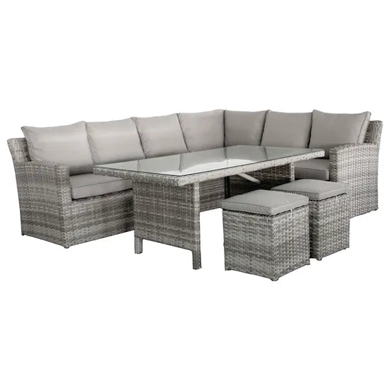 Outdoor sofa with wicker frame, table, two stools and gray cushions on a white background