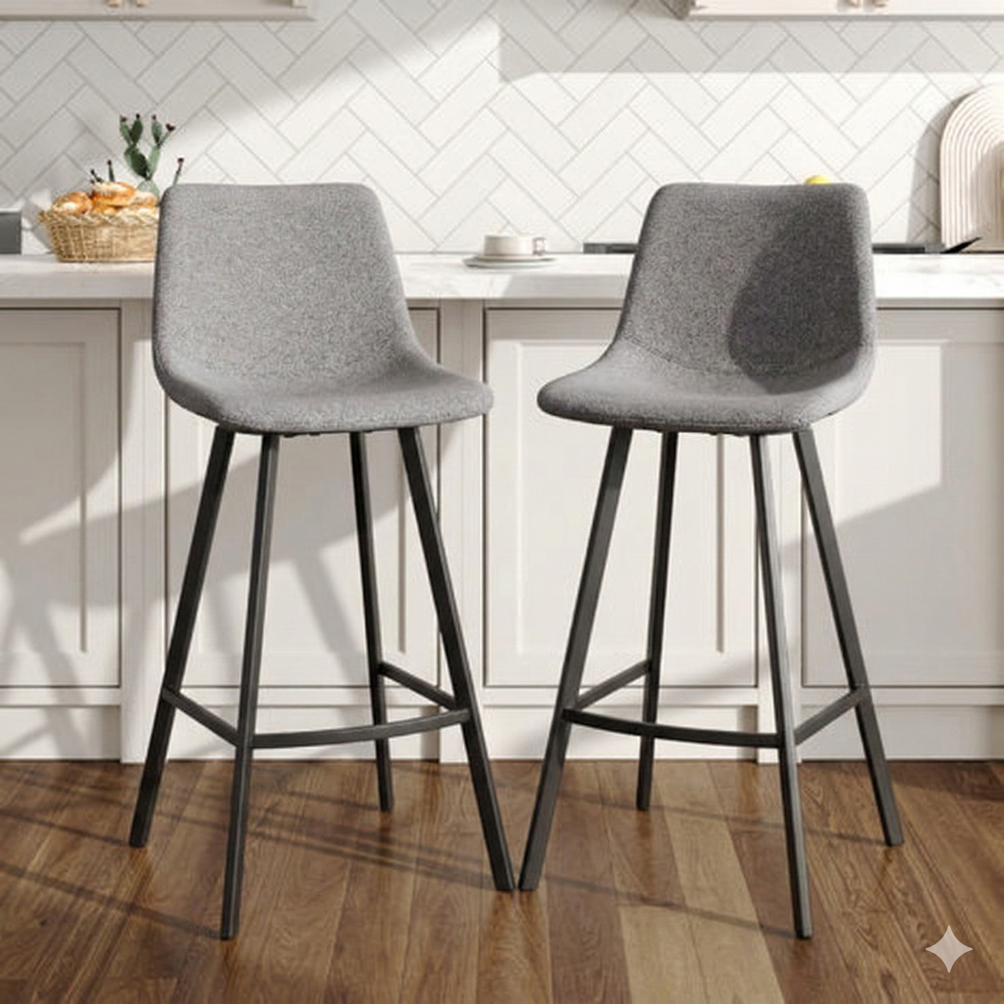 Two gray bar stools with black legs in a kitchen setting.
