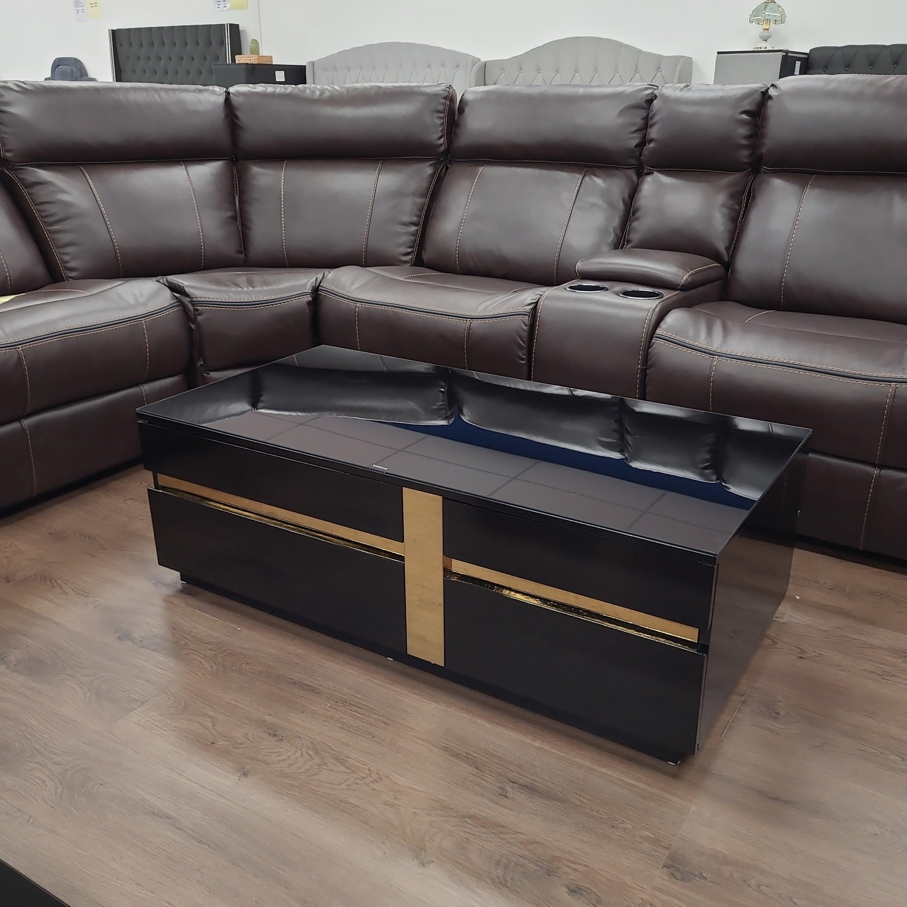 Dakota Coffee Table from The A2Z Furniture - black MDF structure with gold accents, black tempered glass top, and 2 storage drawers