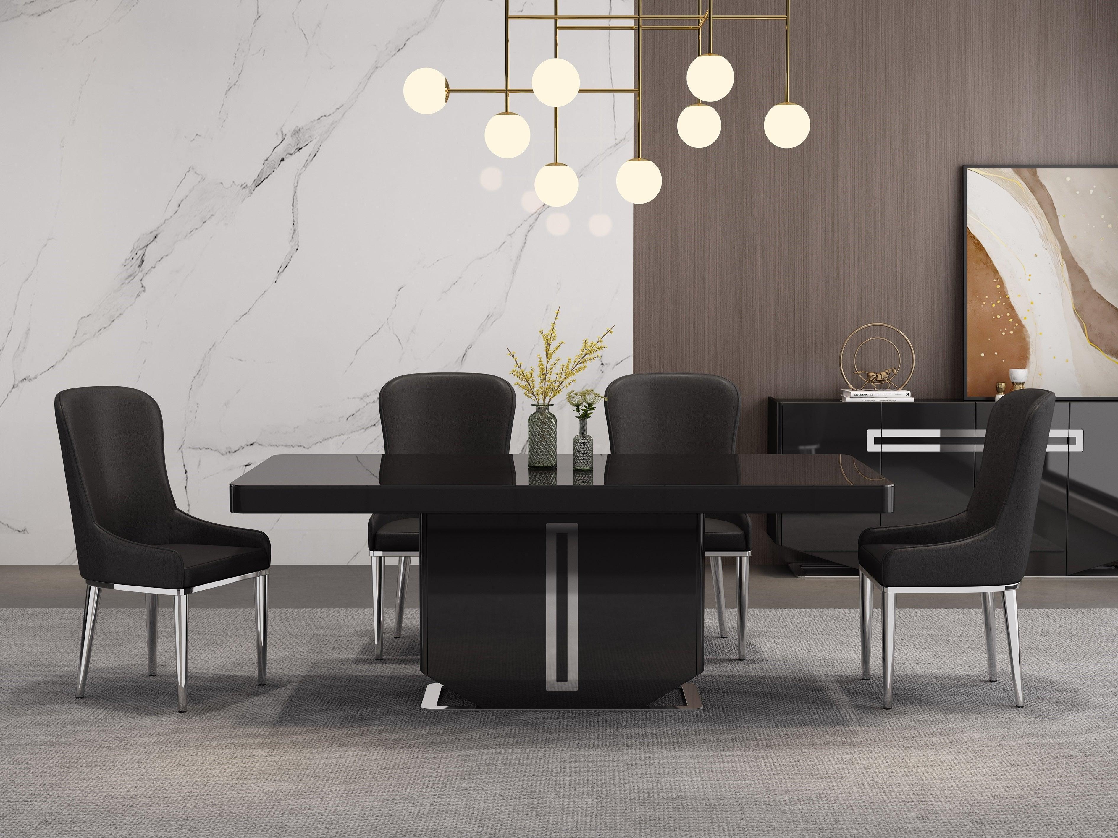 Modern black dining table set with four upholstered chairs, marble and wood accent wall, contemporary decor