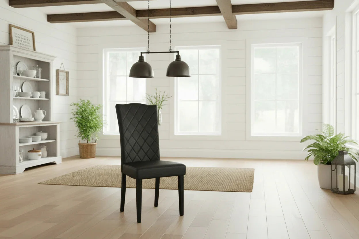 Modern interior with a black chair, white bookshelf, and large windows.