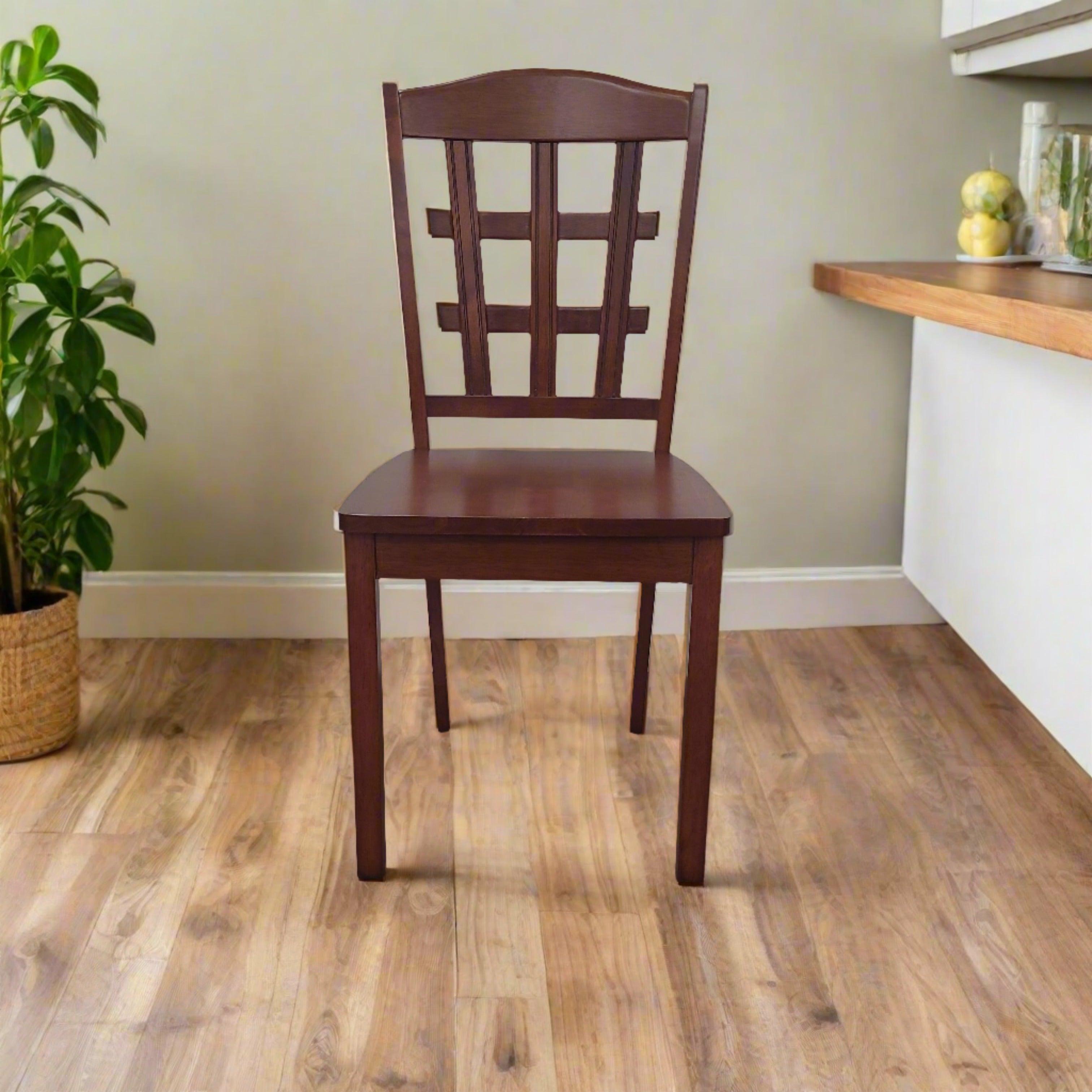 Dark wood dining chair with lattice backrest on timber floor in a modern room