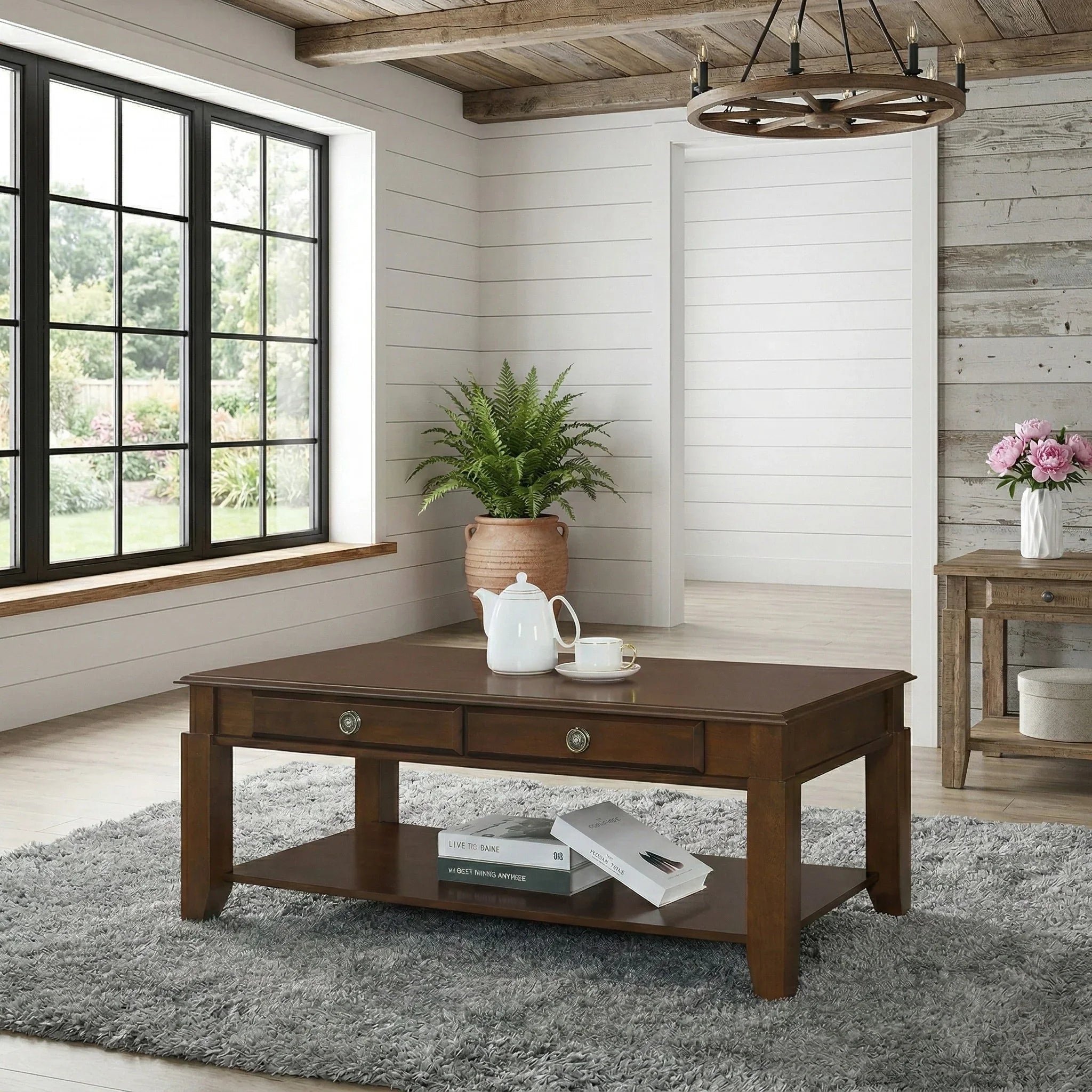 Wooden coffee table in a room with a window, plants, and books.