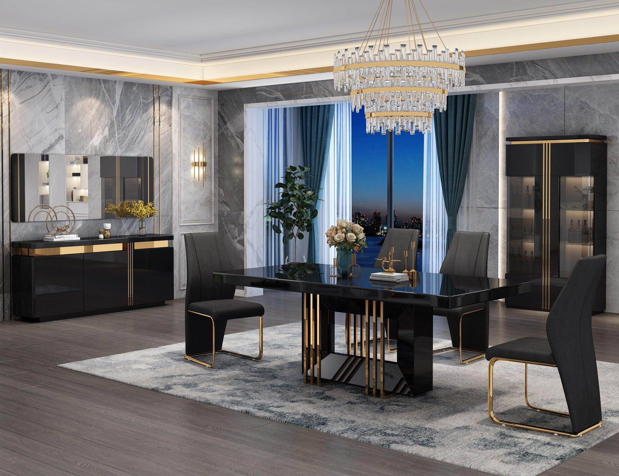 A modern dining table with a black tempered glass top and gold metal legs, surrounded by black chairs with gold accents. The table is set in a stylishly decorated room with large windows and a chandelier.