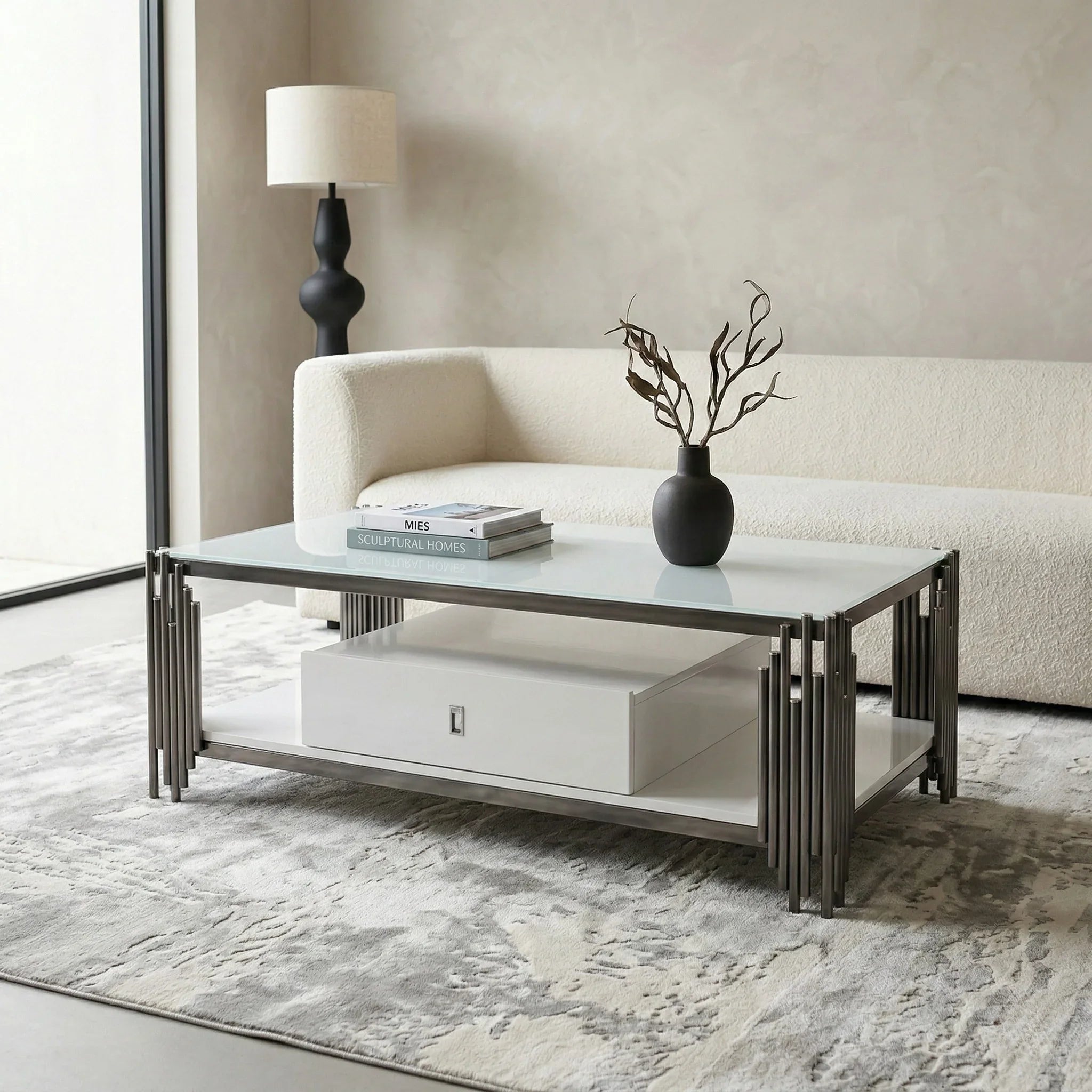 Modern living room with a coffee table, lamp, and vase.