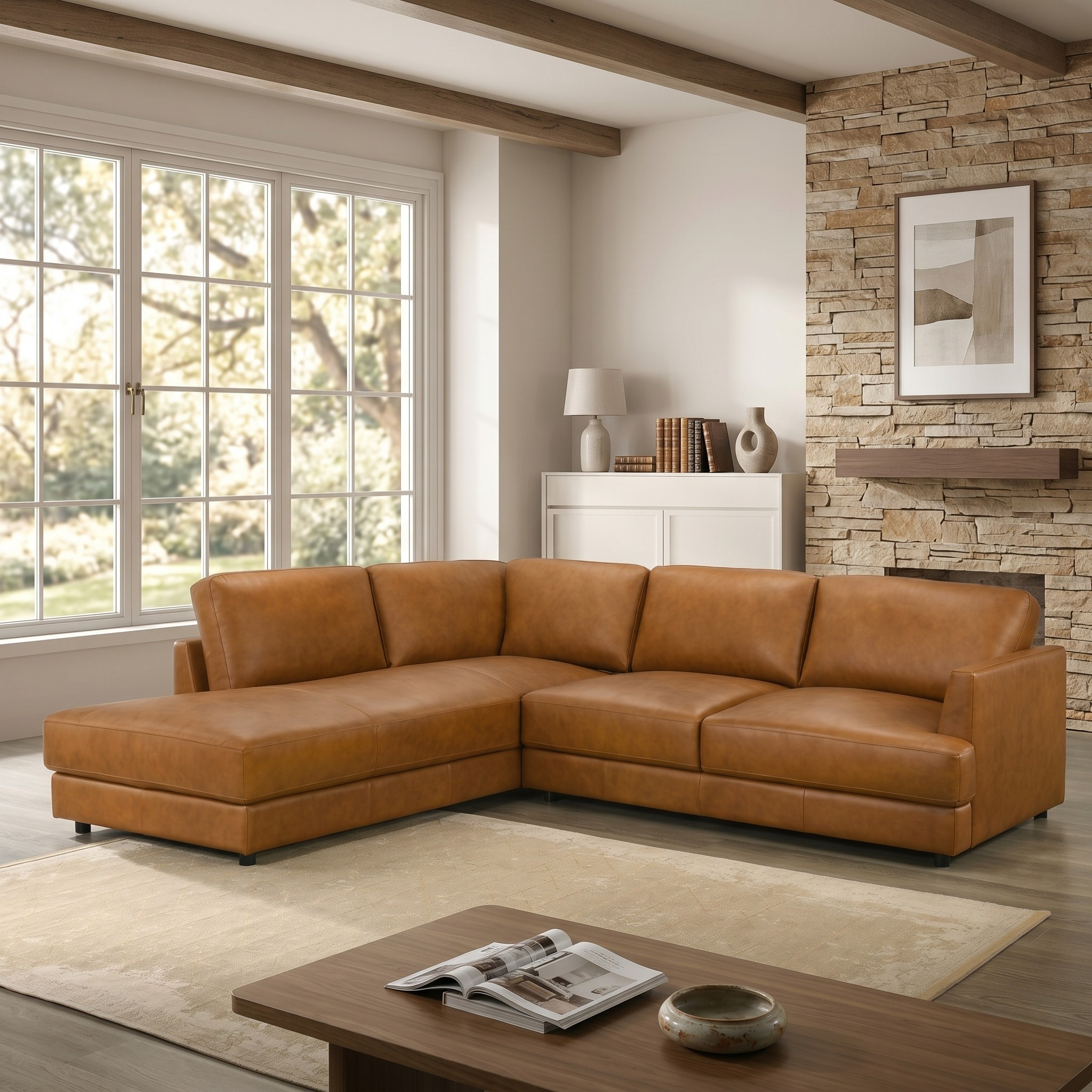 Orange leather sectional sofa in a living room with a stone wall and a large window.
