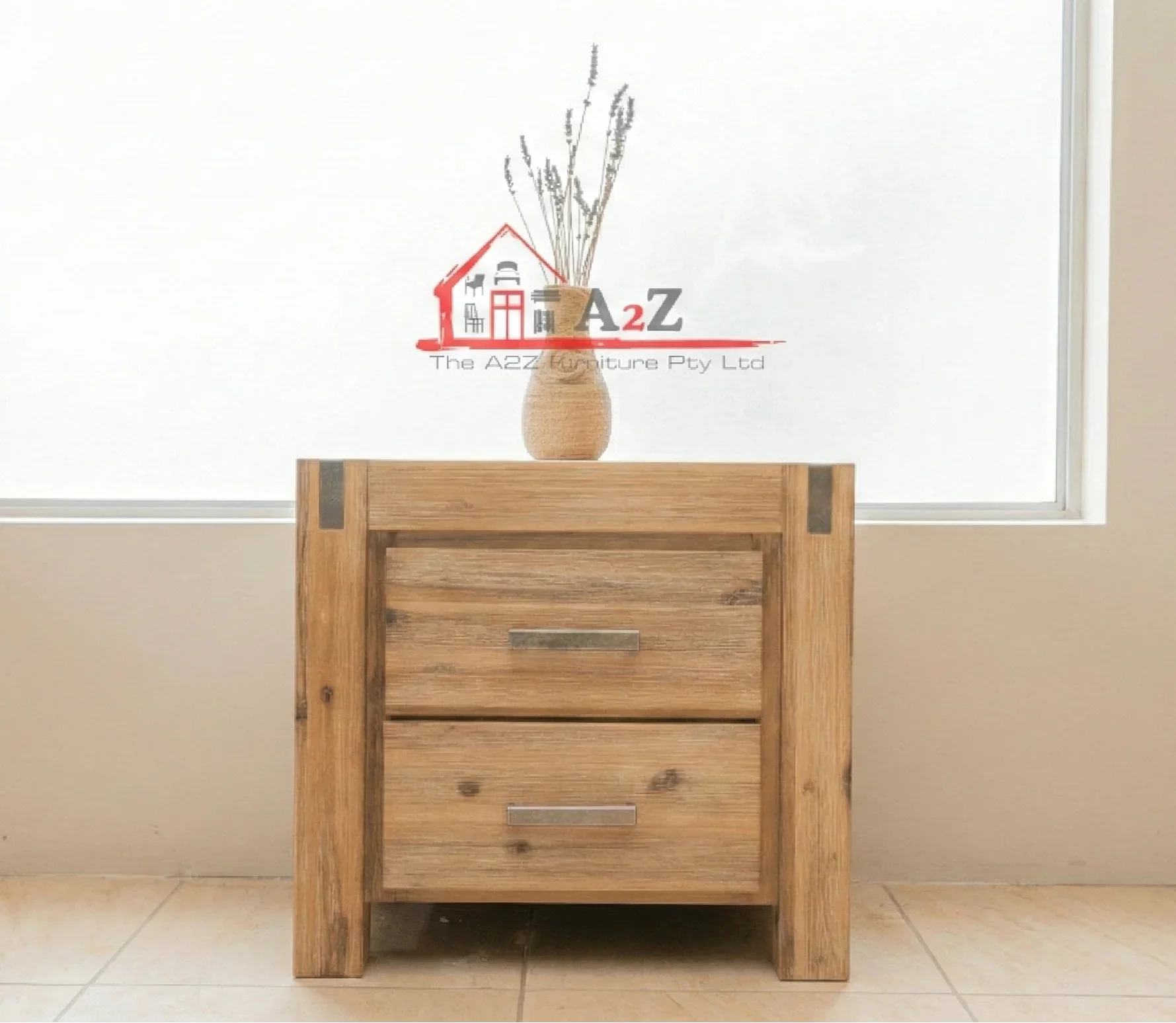 Wooden bedside table with two drawers in a room with a window and beige walls.