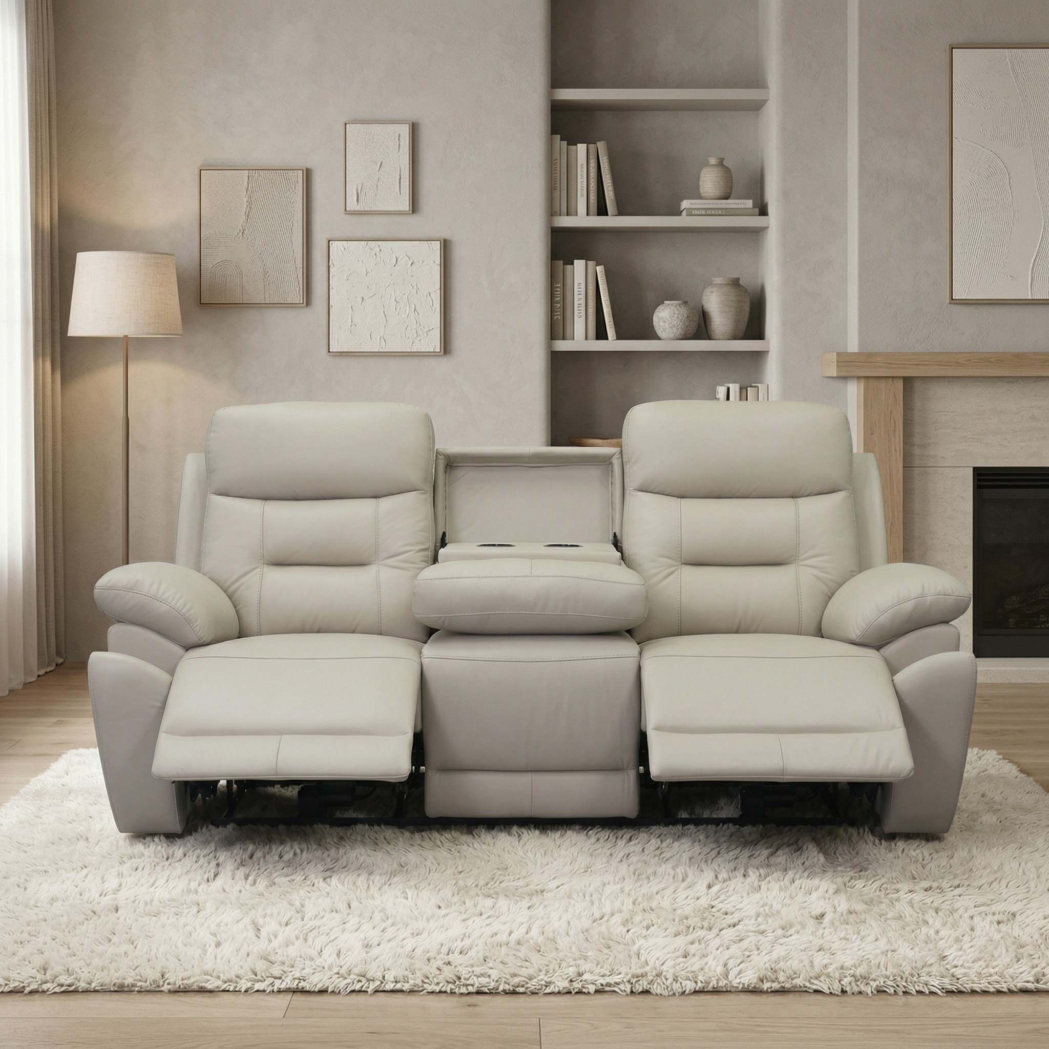 Legend 3 Seater Leather Recliner Lounge in light gray, featuring plush cushioning, two extended footrests, and a center console with cup holders, set in a cozy living room.
