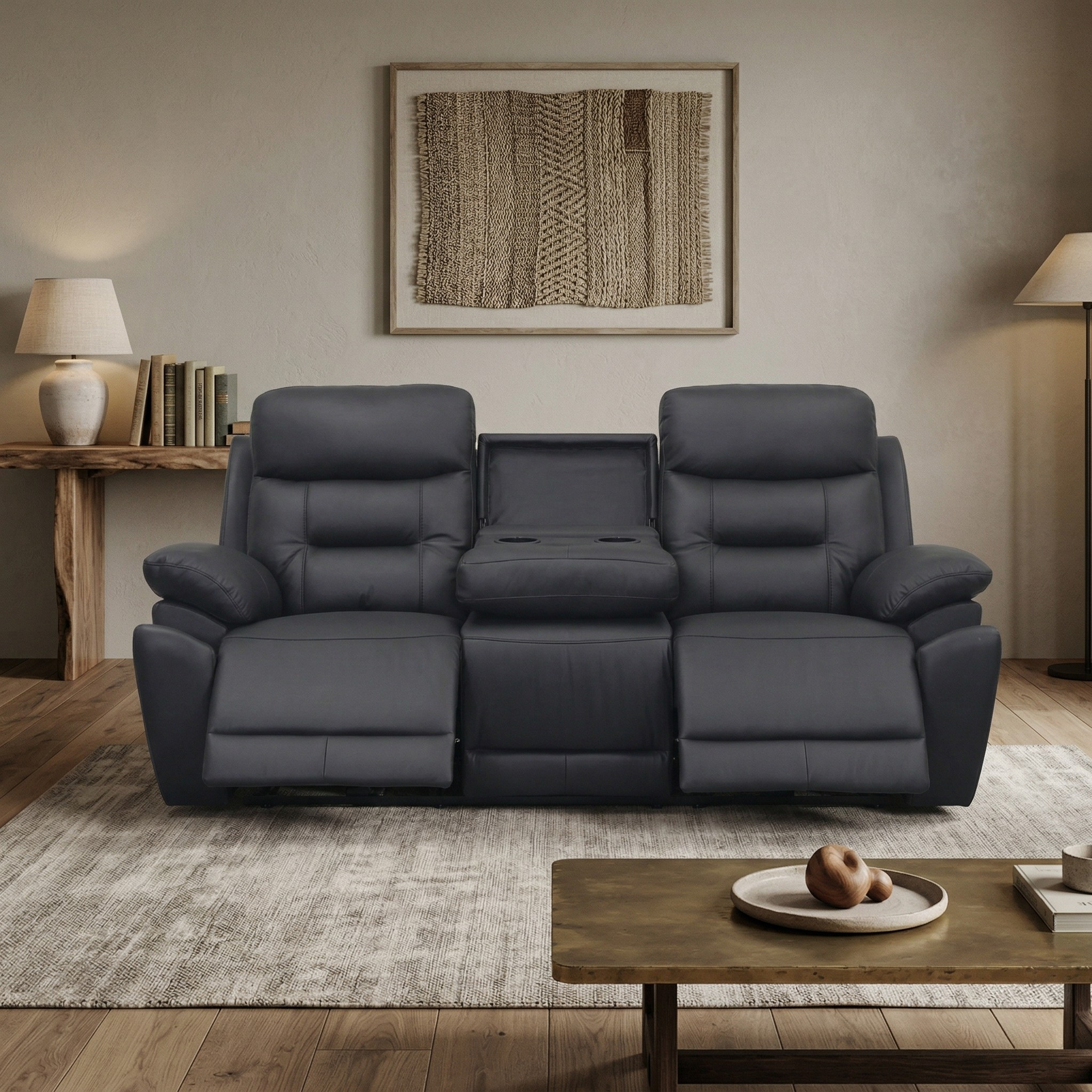 Modern dark grey Legend 3 Seater Leather Recliner Lounge with two reclining seats and a center console, set in a minimalist living room with neutral decor.