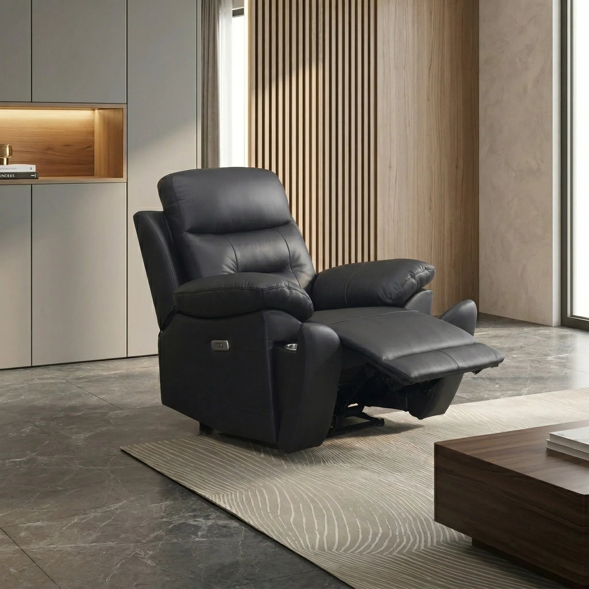 Legend Leather Recliner Chair in black leather, shown fully reclined in a modern living room with marble flooring and wooden accents.