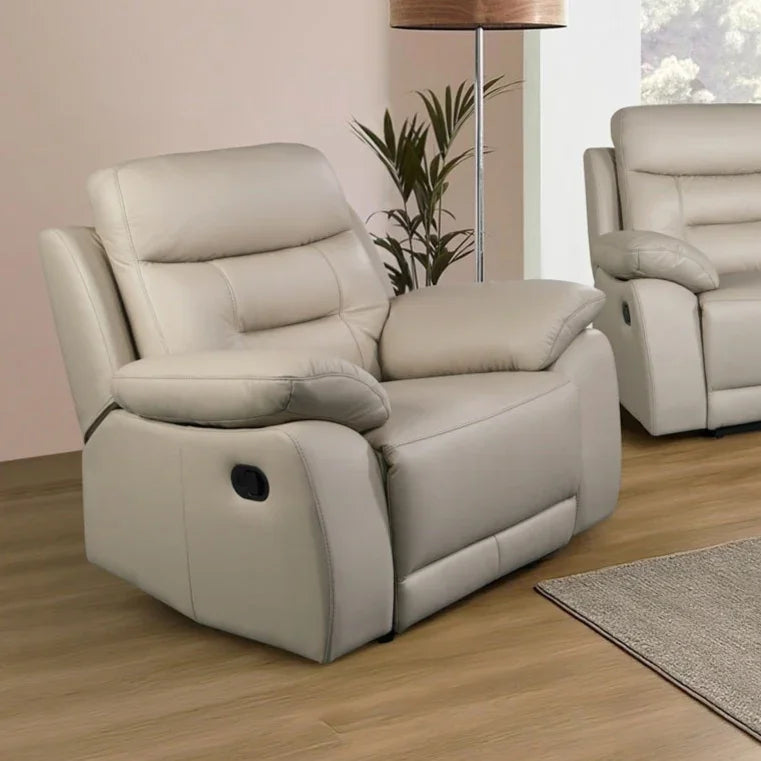 Off-white leather recliner armchair in modern living room with wooden floor and rug