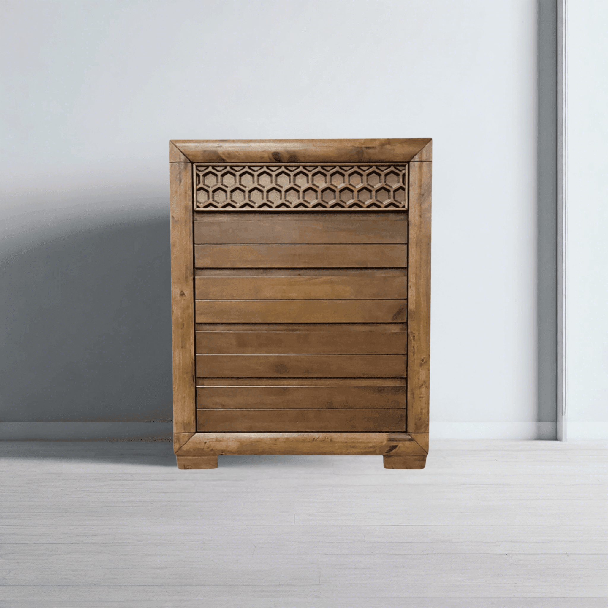 Wooden tallboy chest of drawers with honeycomb carved panel in modern bedroom