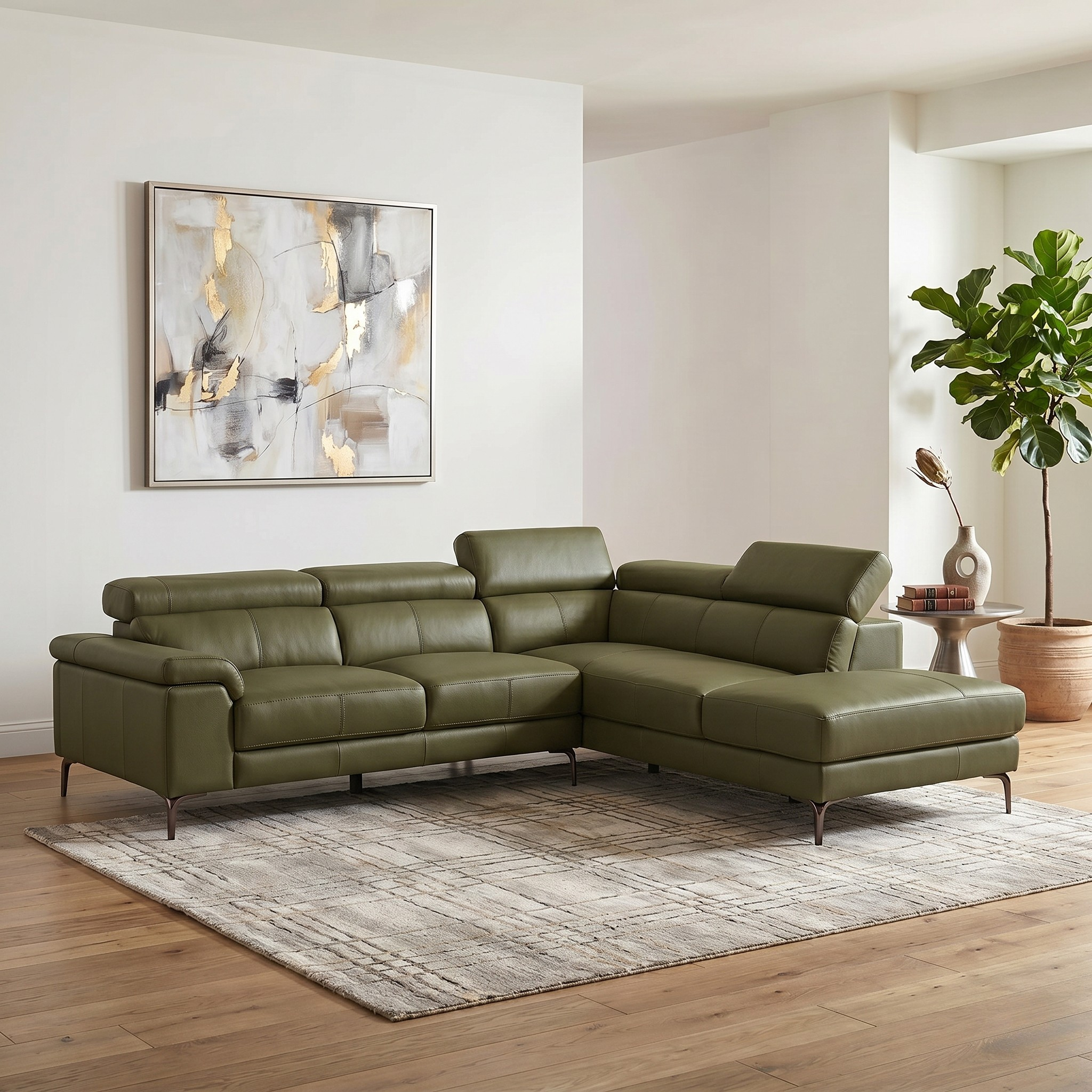 Olive leather sectional sofa in a living room with a rug, plant, and wall art.